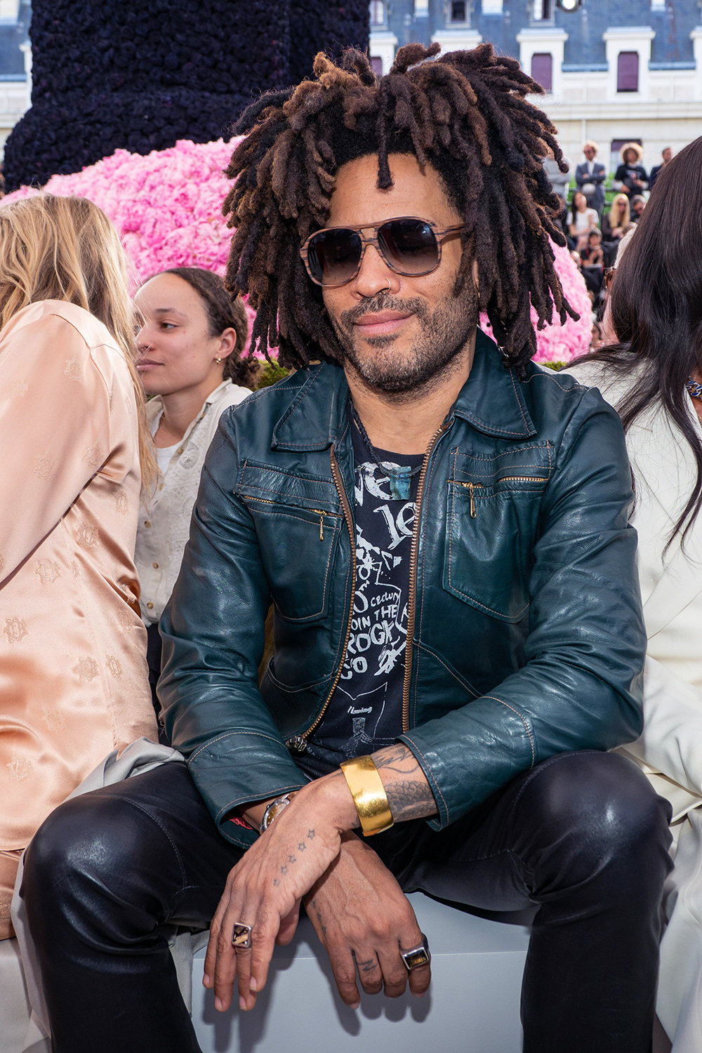 <p>Lenny Kravitz in the front row of the Dior Homme show at Men’s Paris Fashion Week on Jun. 23, 2018. His teal leather jacket was quite striking.</p>