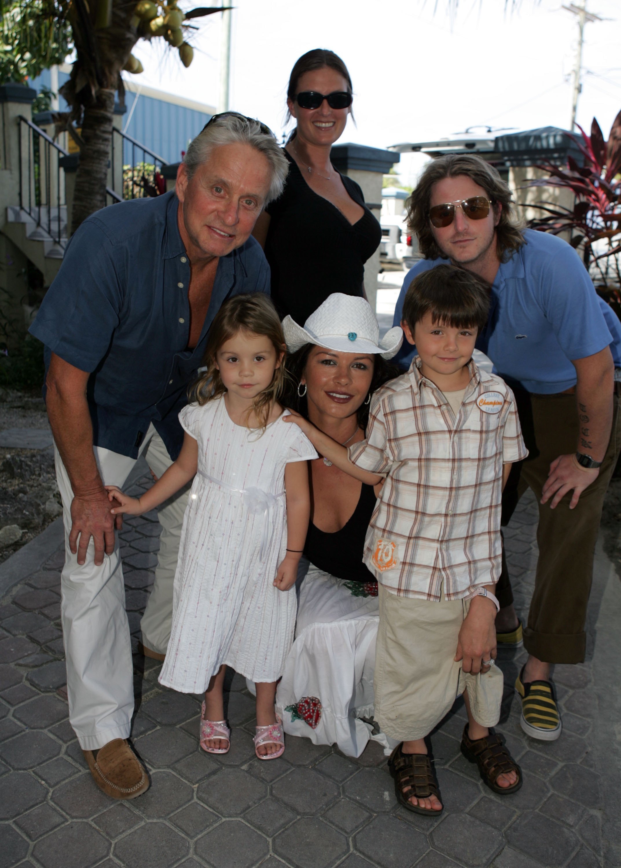 <p>Michael Douglas and wife Catherine Zeta-Jones are pictured with their two kids -- daughter Carys, then 3, and son Dylan, then 6 -- as well as the Oscar-winning actor's adult son from his first marriage, Cameron Douglas, and Cameron's then-girlfriend, Kelly Scott, at Provo airport in Turks and Caicos on Jan. 5, 2007. Keep reading to see the youngest Douglas kids all grown up at Dylan's college graduation...</p>