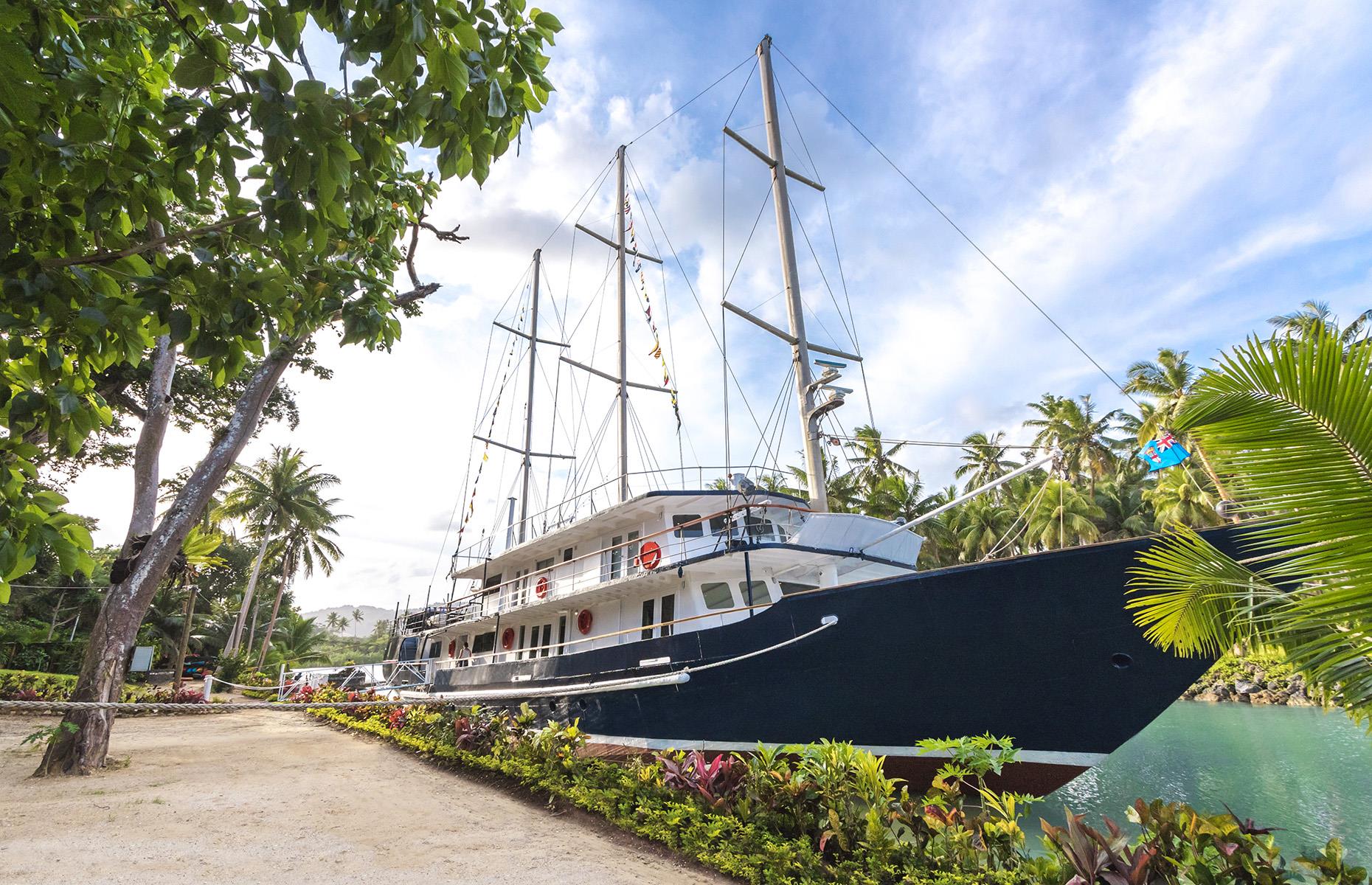 <p>If staying on these paradise islands just isn't cool enough for you, book into <a href="https://www.savasiisland.com/serenity/">Serenity</a> at Savasi Island Resort. This vessel is a 140-foot (43m) schooner moored permanently in the bright blue waters of Savasi Island marina in Savusavu, northern Fiji. There are five staterooms onboard, each with wonderfully light, minimalist decor, as well as a cinema room and restaurant.</p>
