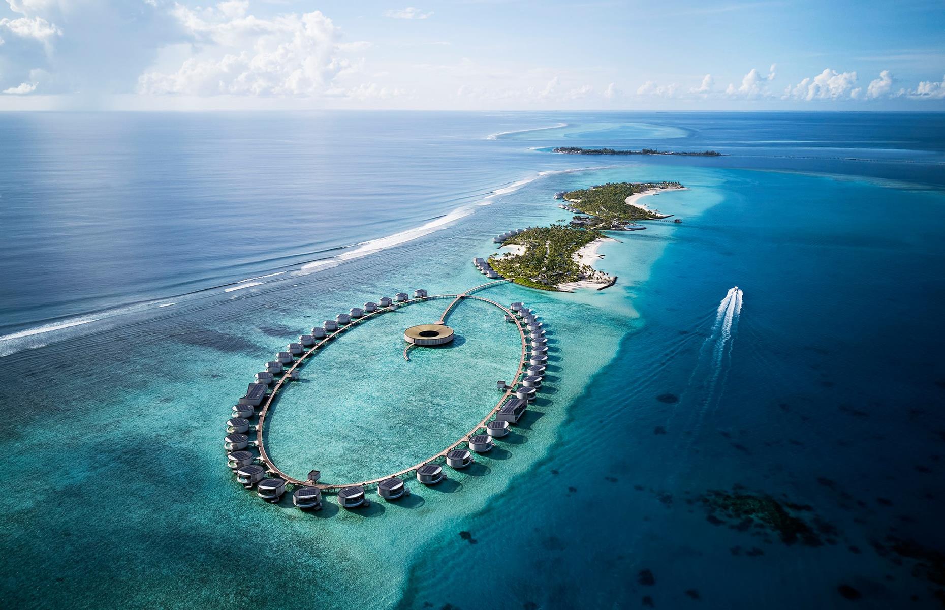 <p>The islands of the Maldives are filled with luxurious properties that make the most of their location in the Indian Ocean location, and <a href="https://www.booking.com/hotel/mv/the-ritz-carlton-maldives-fari-islands.en-gb.html">this</a> is one of the newest. Operated by Ritz-Carlton – and looking particularly spectacular when captured from the sky – it comprises sleek villas arranged in a neat oval shape above the ocean's surface. Each has a private infinity pool, rain showers, floor-to-ceiling glass windows and your own private butler. </p>