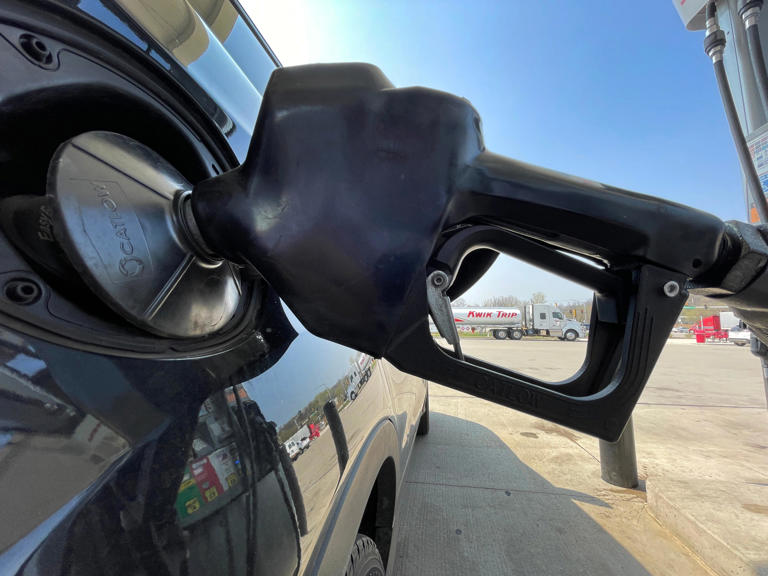 A customer fuels a car Tuesday, May 10, 2022 at Kwik Trip, 2900 Holy Hill Rd. in Richfield, Wis. As of Sunday, the average price at the pump is $1.36 higher than it was one year ago. Most gasoline sold in the U.S. is blended with 10% ethanol, a biofuel that is currently cheaper than gas. In April, President Biden announced that the Environmental Protection Agency will issue an emergency waiver to allow widespread sale of a 15% ethanol blend that is usually prohibited between June 1 and Sept. 15 because of concerns that it adds to smog in high temperatures. The waiver is another effort to help ease global energy markets that have been rocked since Russia invaded Ukraine.