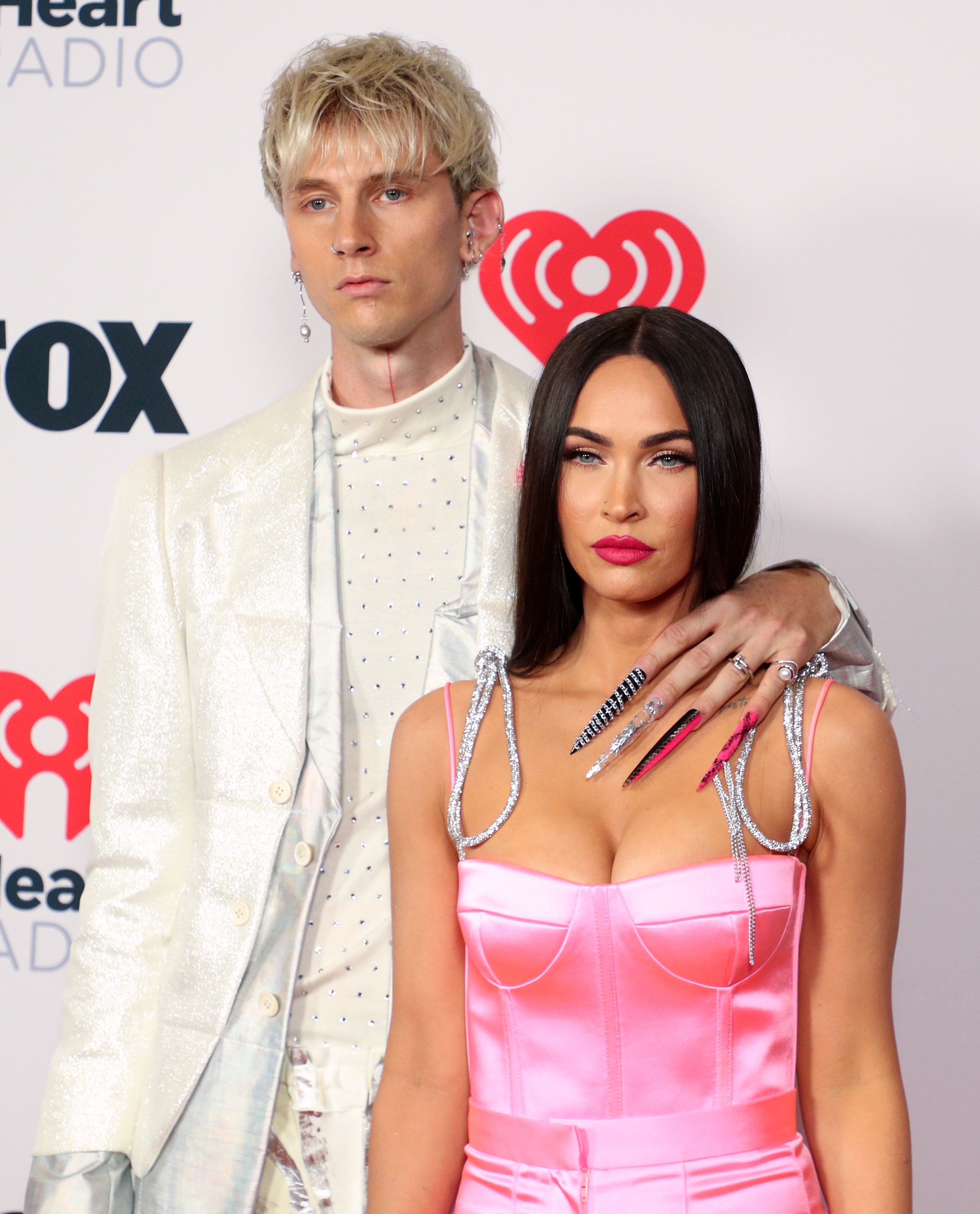 <p>Megan Fox and Machine Gun Kelly (real name: Colson Baker) -- who <a href="https://www.wonderwall.com/celebrity/couples/stars-who-got-engaged-in-2022-546944.gallery?photoId=535539">got engaged</a> in January 2022 -- have let people think they met while filming the 2021 movie "Midnight in the Switchgrass" in 2020, but they actually met a few years earlier at a GQ party in Los Angeles, they told <a href="https://www.gq-magazine.co.uk/culture/article/megan-fox-machine-gun-kelly-interview">the magazine</a> in 2021. (She was still married to actor Brian Austin Green at the time.) "This weird thing happened. We didn't see each other," she said, asking MGK, "Do you remember [seeing] my face?" to which he replied, "That's what's crazy. I don't. I don't remember your face." She doesn't remember seeing his either. "I just remember this tall, blonde, ghostly creature and I looked up and I was like, 'You smell like weed.' He looked down at me and he was like, 'I am weed.' Then, I swear to God, he disappeared like a ninja in a smoke bomb." When they reunited on the set of their movie, sparks flew, and they soon became a couple as she moved on from her marriage. The musician-actor told GQ that for their first real date, he picked Megan up in a 1974 Cadillac convertible. They listened to Ella Fitzgerald songs and he drove her to the edge of a canyon where his friend had set the mood, prepping the spot with roses and a picnic. They then drove down Sunset Boulevard to the Roxy Theatre, a music venue. But it was closed, so "we went to the roof and played pop punk [music] and made out," MGK told GQ. </p>