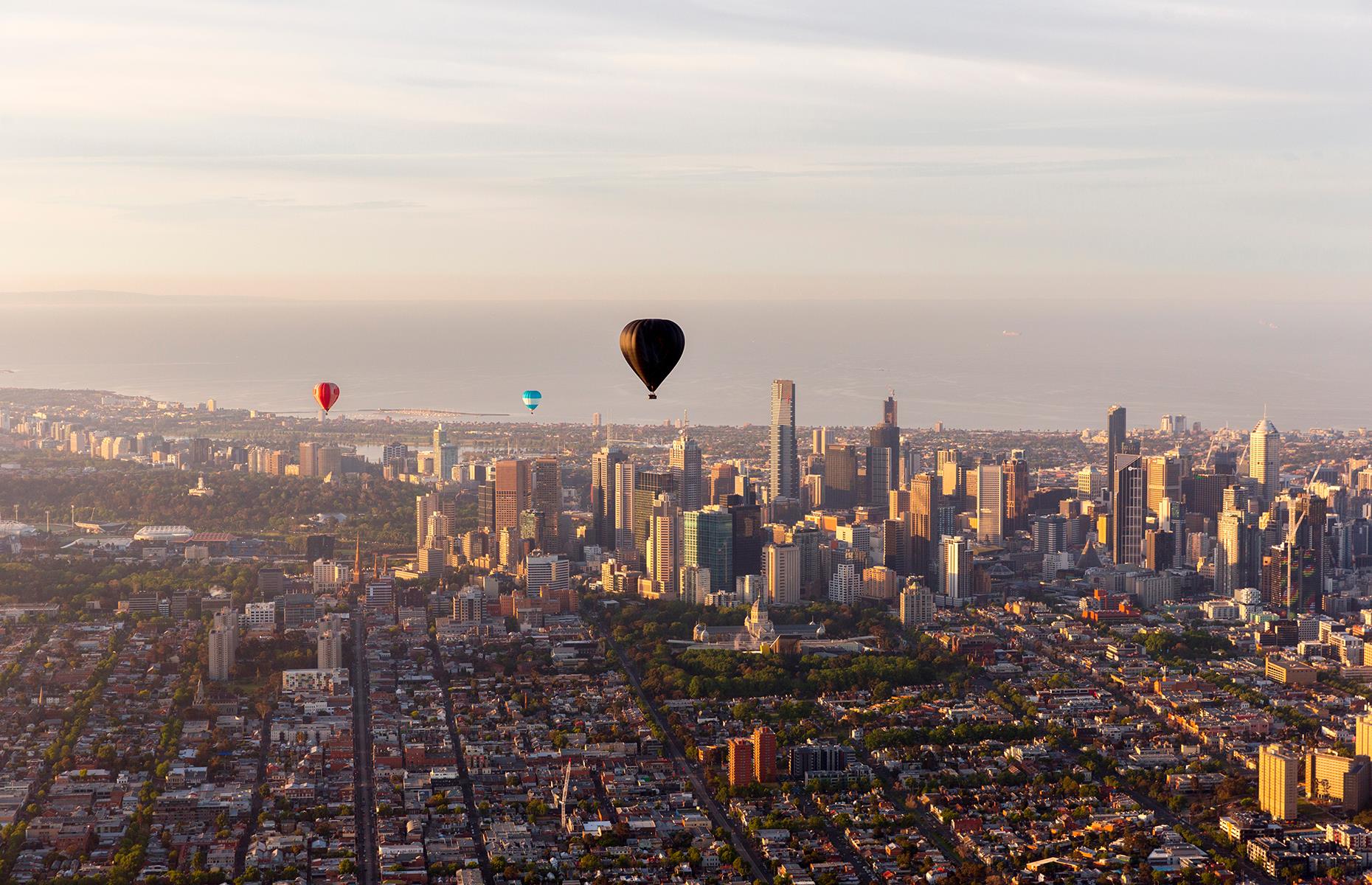 <p>Many hot air balloons take flight over areas of natural beauty, but soaring above a city is just as exciting. In Australia, you can take off from the suburbs of Melbourne and glide straight past the city's skyscrapers and above its biggest landmarks, from stadiums to the grand Melbourne Museum. See the roads slowly get busier as commuters make their way to work, spot the Grand Prix circuit and the Olympic Park, and wave at residents as you glide past apartment buildings close enough to see what's for breakfast.</p>