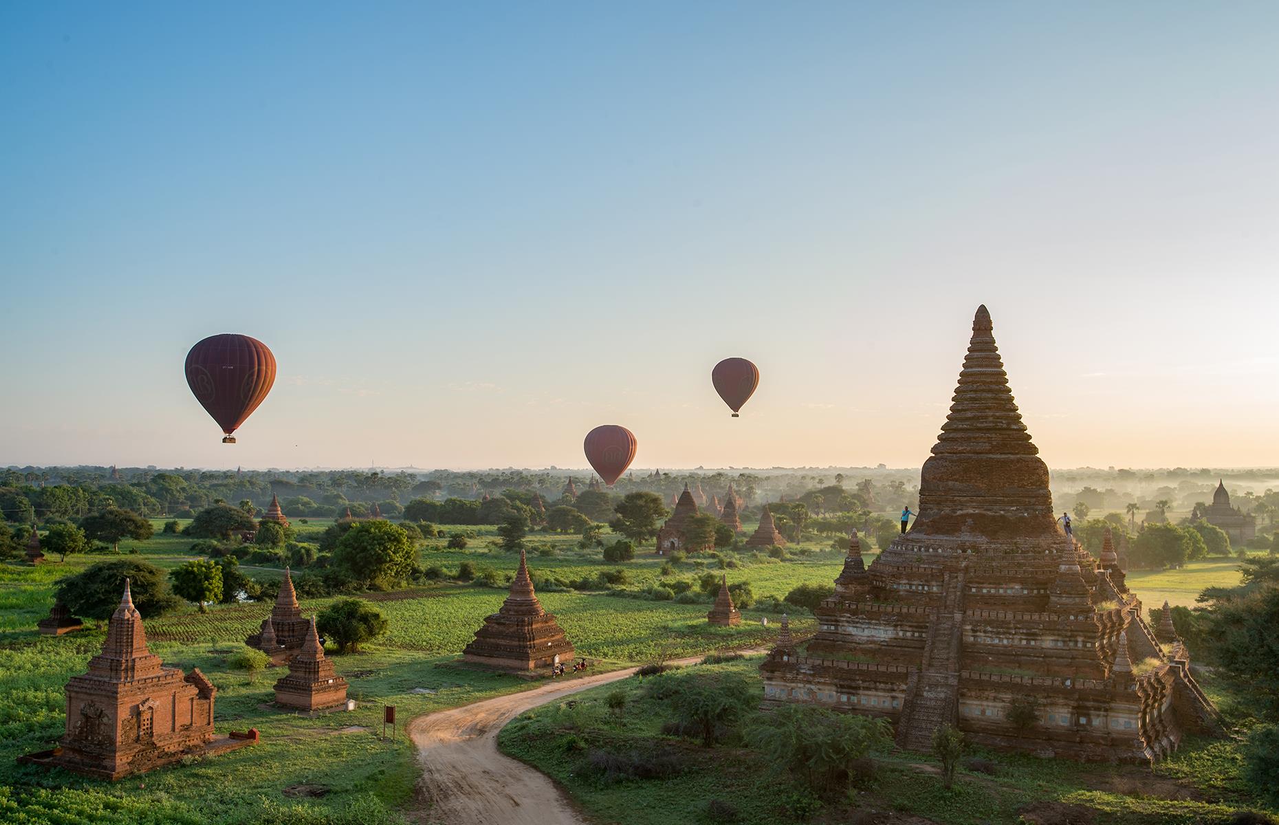 Over 2,000 Buddhist structures dot the plains of Bagan and the sight of hot air balloons rising at dawn to take in the landscape is truly memorable. Join one of those balloons and you'll get a stunning overview of the vast area, where crumbling stupas and monasteries, many of them around a thousand years old, stand tall amid lush green scenery. It's just as evocative on the ground too, so once you've seen it all from above, walk among the ruins to see the Bagan of old up close.