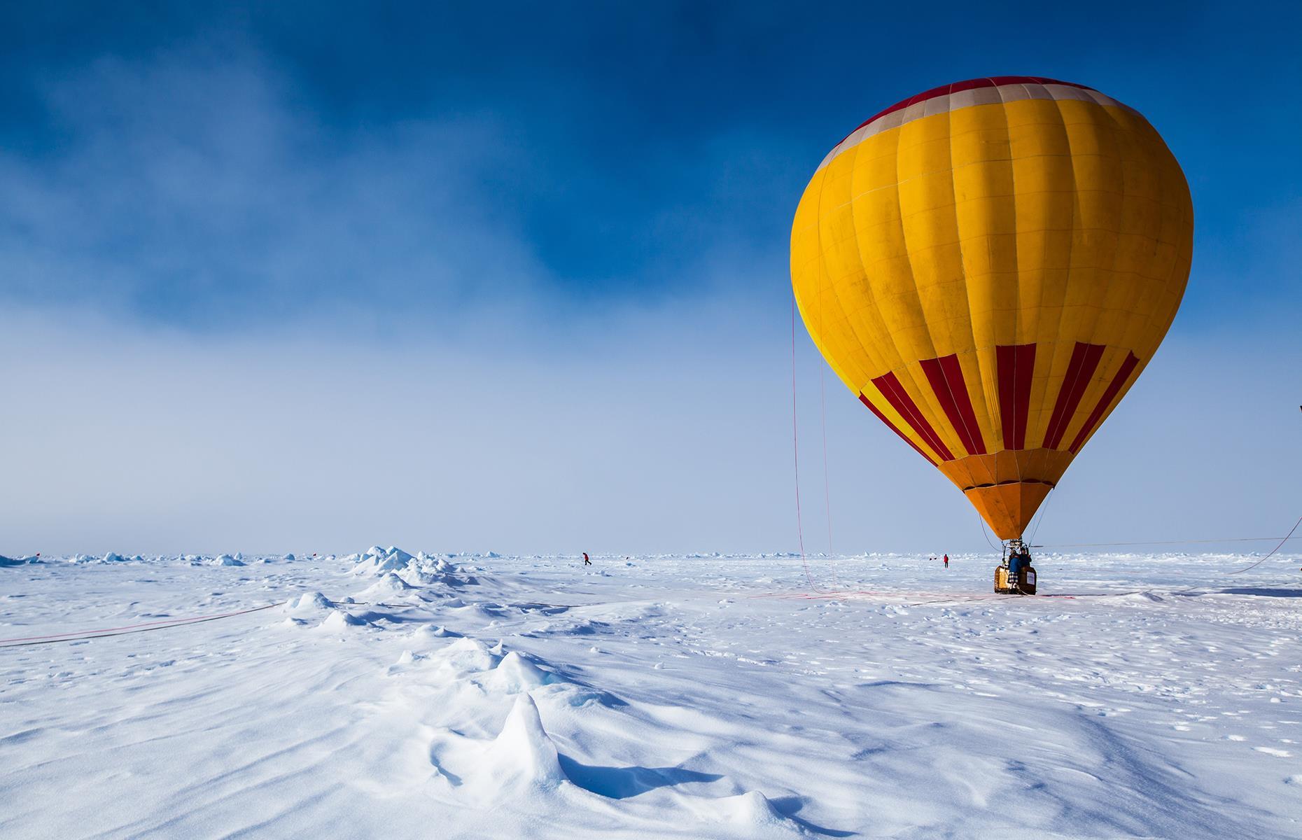 <p>For extreme adventurers, hot air ballooning in the North Pole has an added challenge: getting there. Whether you decide to take the long, cold, arduous trek or take the easier route via helicopter, the journey is all part of the fun. Once you find yourself at 90-degrees north, jump in <a href="https://www.quarkexpeditions.com/gb/arctic/adventure-options/hot-air-ballooning-0">Quark Expeditions</a>' hot air balloon to admire the top of the world from above. A white expanse will slope away beneath you as the balloon climbs and you'll really get a whole new perspective on the vast, white Arctic.</p>