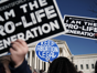 Pro-life activists try to block the sign of a pro-choice activist during the 2018 March for Life January 19, 2018 in Washington, DC. Activists gathered in the nation's capital for the annual event to protest the anniversary of the Supreme Court Roe v. Wade ruling that legalized abortion in 1973. (Photo by Alex Wong/Getty Images)