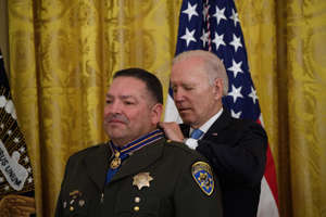 US President Joe Biden presents the Medal of Valor to Vincent Mendoza, of the California Highway Patrol, during a ceremony at the White House in Washington, DC, on May 16, 2022.