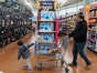 A boy and his father walk through the toy section of Walmart on Black Friday, a day that kicks off the holiday shopping season, in King of Prussia, Pennsylvania, U.S., on November 29, 2019. REUTERS/Sarah Silbiger.