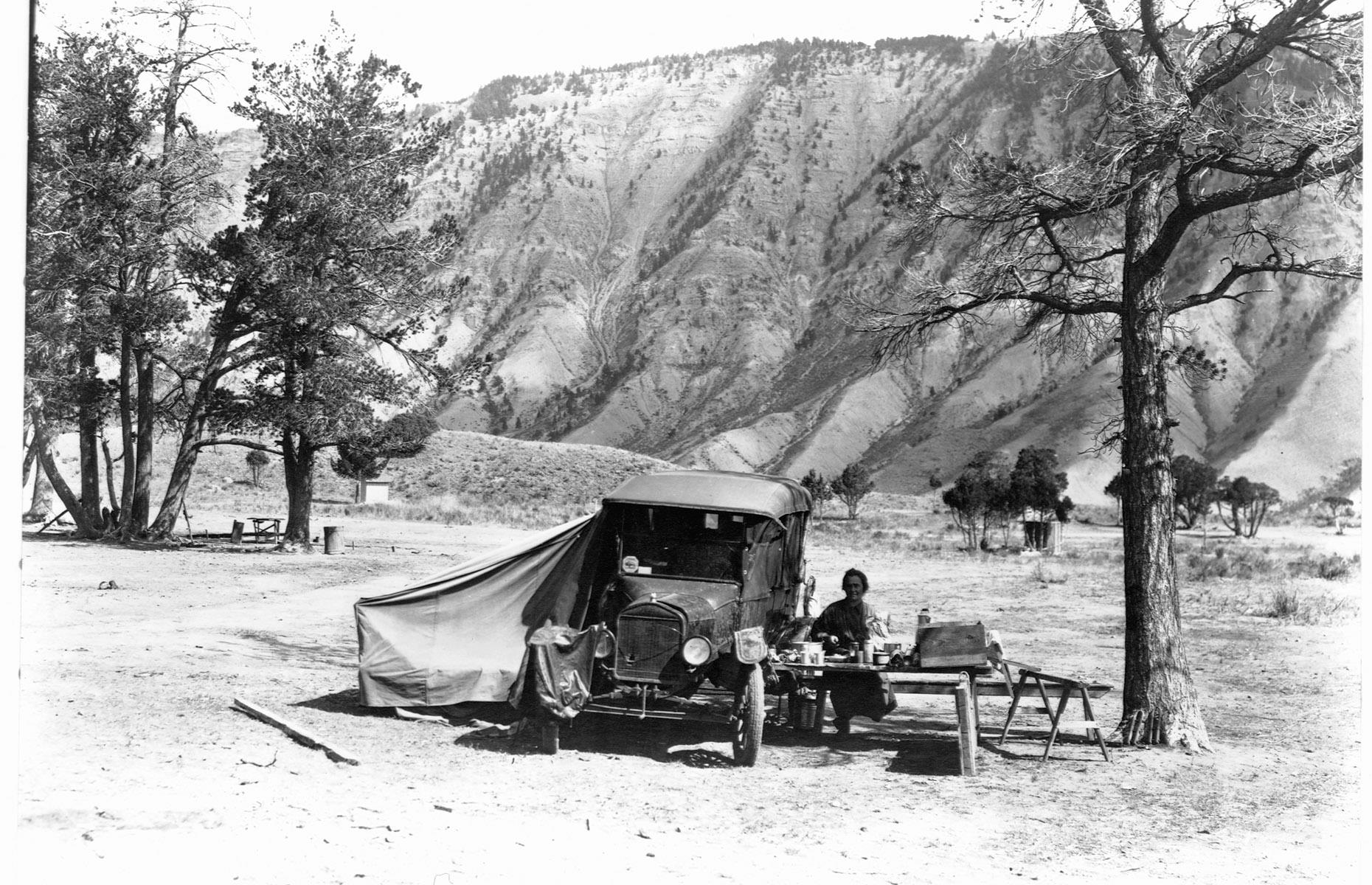 Car production boomed through the Roaring Twenties and a rapidly increasing number of American households owned vehicles. That meant that wide-open wildernesses like Yellowstone National Park were ripe for exploration. Here, in 1920, early campers make the most of a tent attached to their car, in Yellowstone's Mammoth Hot Springs area.