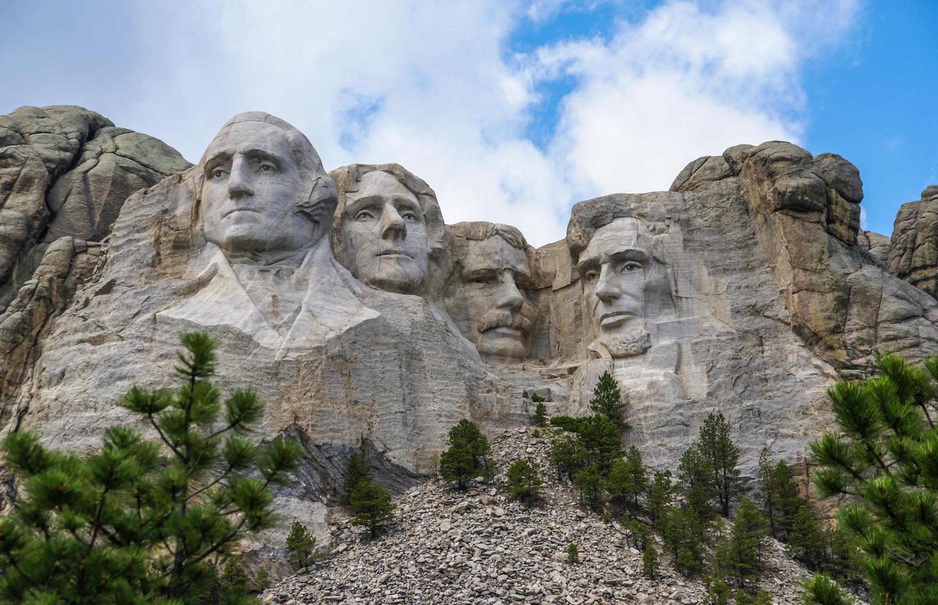 <p>In the craggy Black Hills of South Dakota, not far from the little town of Keystone, you'll find <a href="https://www.nps.gov/moru/index.htm">the faces of four formative American presidents</a> carved into rock. George Washington, Theodore Roosevelt, Thomas Jefferson and Abraham Lincoln stare out from the stone at the Mount Rushmore National Memorial, and have done since 1941 when the mammoth project was completed. The hulking heads are each around 60-feet (18m) tall and you can view them best along the short Presidential Trail (be aware that the route includes 422 stairs). </p>