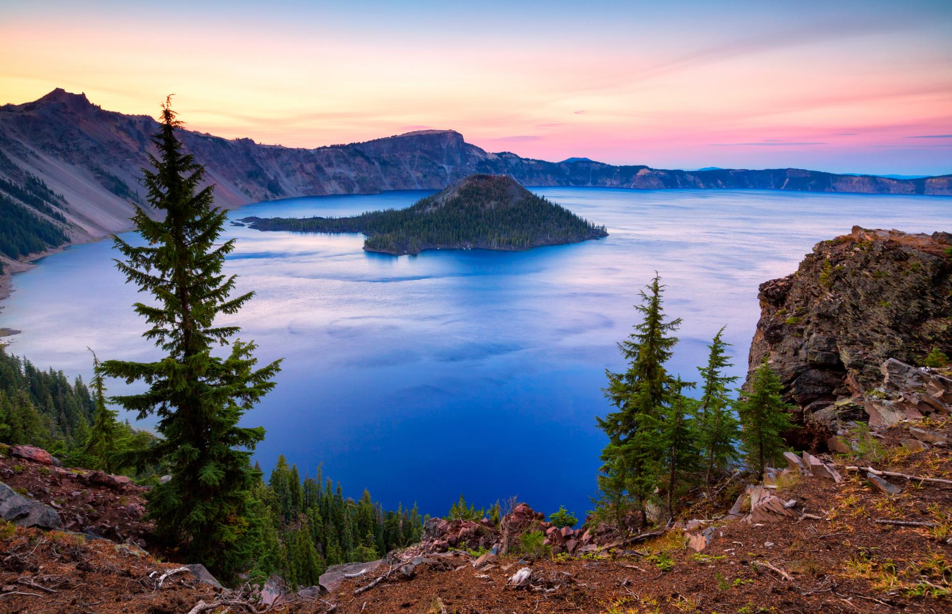 <p>Named for the bright blue Crater Lake (the deepest in the USA), <a href="https://www.nps.gov/crla/index.htm">this national park</a> is also beloved for its old-growth forests and wildflower meadows. The lake itself, formed by a volcanic eruption more than 7,000 years ago, is best viewed from the 33-mile (53km) Rim Drive – traveling all the way around the water, the route is punctured with scenic overlooks. The sight of cinder cone Wizard Island rising from the waters is one to remember.</p>  <p><a href="https://www.loveexploring.com/galleries/123234/american-beauties-the-best-national-park-in-every-state?page=1"><strong>American beauties: the best national park in every state</strong></a></p>