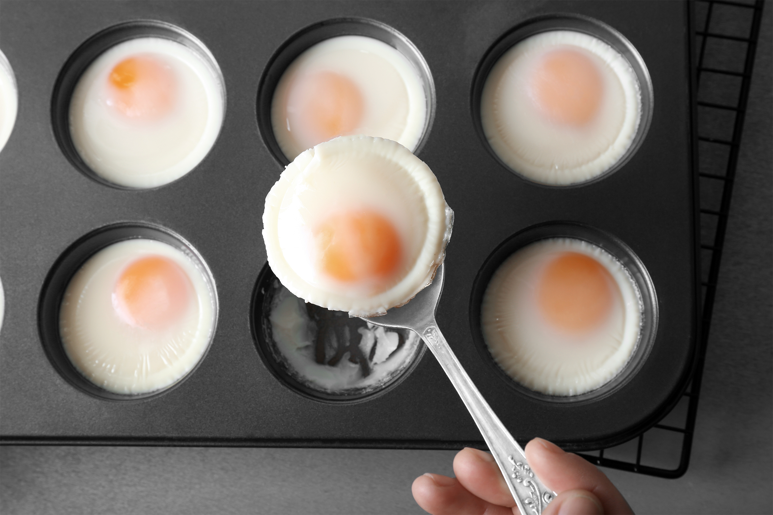 <p>The easiest and most elegant way to serve baked eggs is in small ramekins, although a muffin tin works too. Preheat the oven to 350 degrees. For each serving, break two eggs and empty them into a greased ramekin (or muffin tin). Carefully spoon 1 tablespoon milk or cream over the eggs, making sure to cover them evenly, and sprinkle with salt and pepper to taste. Bake for about 15 minutes, or until the eggs are set and baked to perfection. Enjoy!</p>