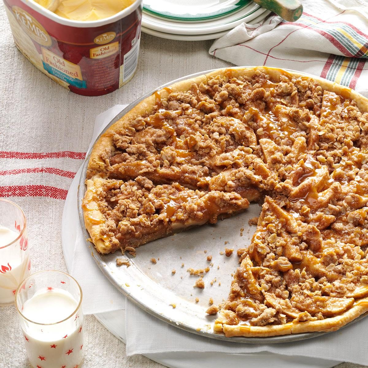<p>While visiting a Wisconsin orchard, I tried a tempting apple crisp pie. At home, I put together this apple pizza. As it bakes, the enticing aroma fills my kitchen, and friends and family linger waiting for a sample. —Nancy Preussner, Delhi, Iowa</p> <div class="listicle-page__buttons"> <div class="listicle-page__cta-button"><a href='https://www.tasteofhome.com/recipes/apple-crisp-pizza/'>Go to Recipe</a></div> </div>