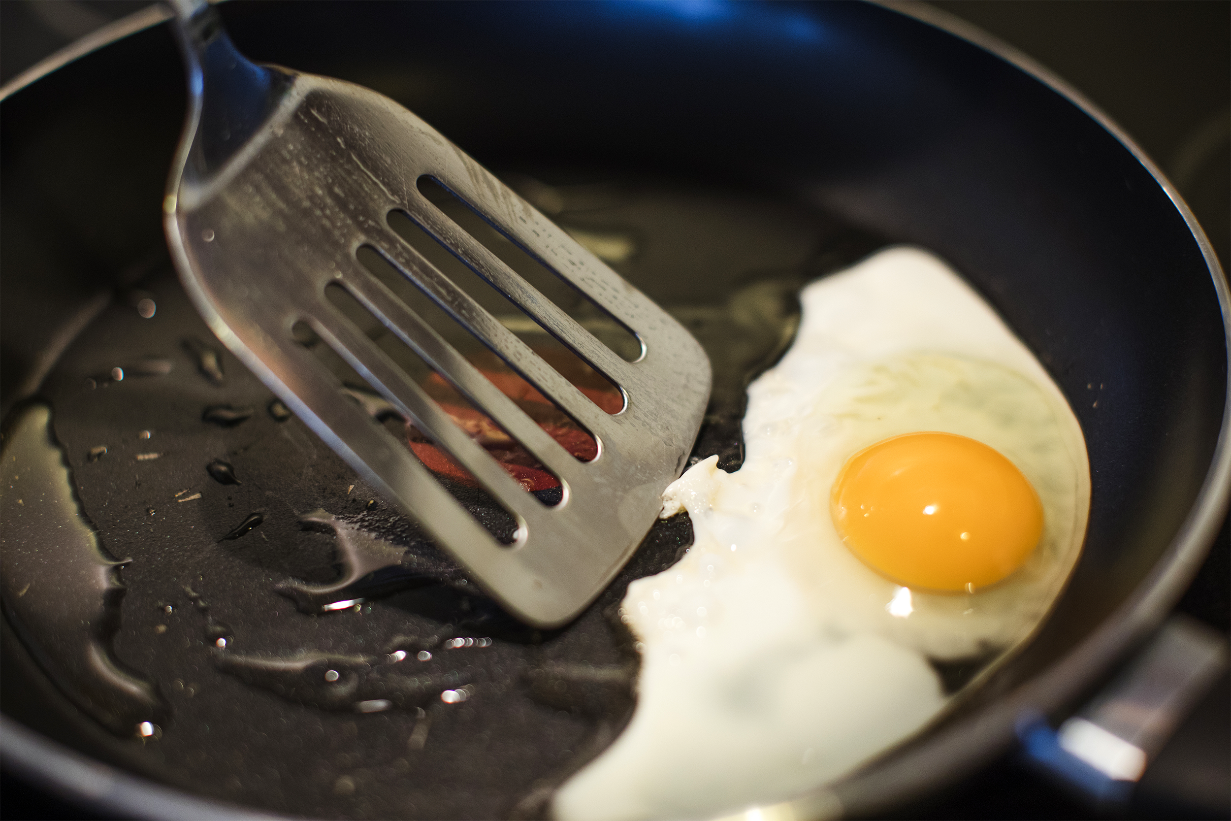 <p>For novice cooks, the hardest part of frying an egg is probably flipping it without breaking the yolk. Start by melting 1 tablespoon of butter or cooking oil in a <a href="https://blog.cheapism.com/best-kitchen-tools-15679/">nonstick frying pan</a> over medium-high heat. If using cooking spray instead, heat the pan until a drop of water sizzles instantly and evaporates on contact, then spray. Break the egg, pour it carefully into the pan so the white and the yellow don't intermix, and immediately turn the heat to medium-low. Once the white has set completely, flip it over carefully. Cook for another 1 to 3 minutes, until the yolk reaches the desired firmness and is less runny. Serve fried eggs immediately with toast to mop up any leftover yolk. Fried eggs are also popular as a sandwich ingredient or a topping for other breakfast items, such as <a href="https://blog.cheapism.com/ideas-for-rosh-hashanah-dinner-leftovers-14506/">corned beef hash</a>, or even pasta for dinner.</p>