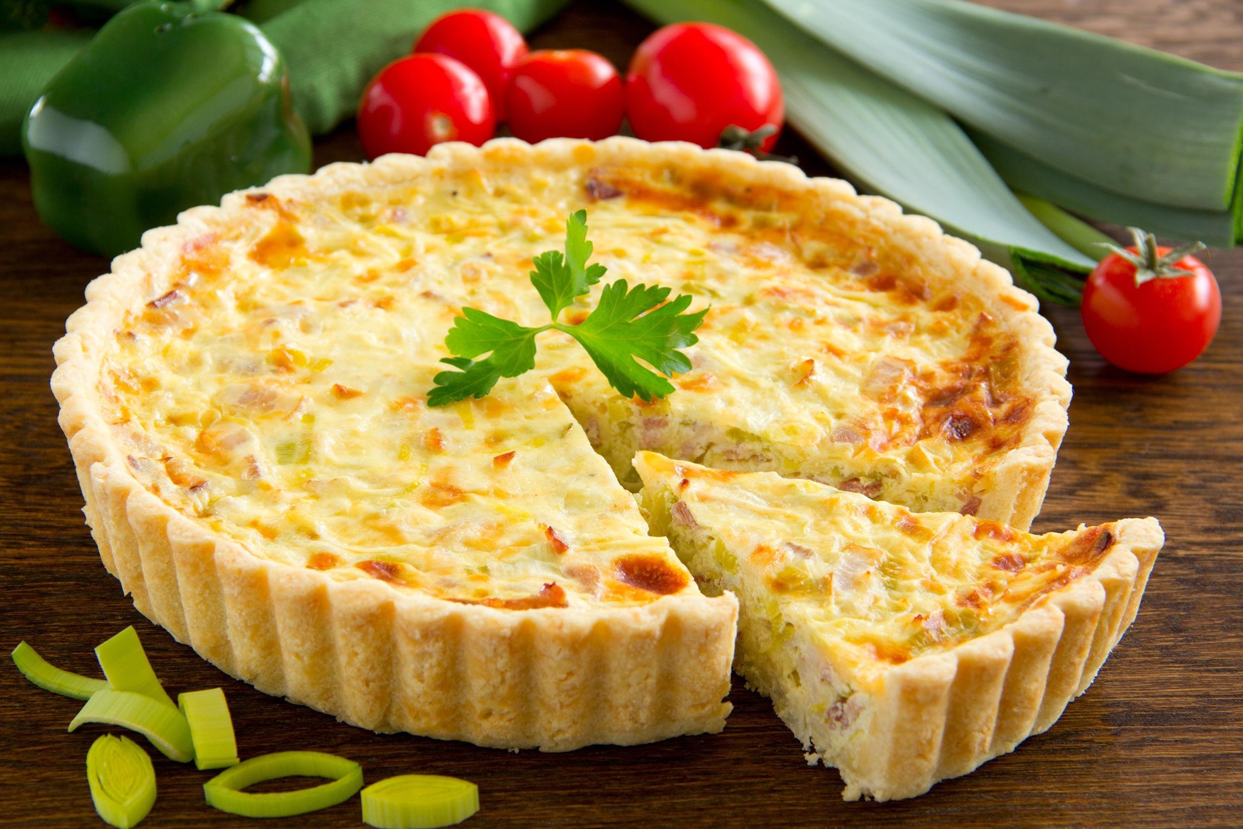 <p>Don't let the <a href="https://blog.cheapism.com/cheap-classic-french-dishes-14097/">fancy French name</a> fool you; a quiche is simply a delicious egg and cheese pie, which is easy to make with crispy <a href="https://blog.cheapism.com/cheap-and-easy-pie-recipes-for-national-pie-day-15471/">store-bought pie crust</a>. While preheating the oven to 425 degrees, beat together four eggs and 1 cup milk or cream in a mixing bowl. Be sure to beat them well, or else the quiche will have a dense texture. Add 1 teaspoon salt, 1 teaspoon onion powder, and one-half teaspoon cayenne pepper, and beat again. Sprinkle 1 cup shredded cheddar cheese over the bottom of a 9-inch pie crust and pour the contents of the bowl carefully over it. (Although a different type of shredded cheese can be used to cook a quiche, a good, sharp cheese is preferable; mild cheeses are more likely to be overwhelmed by the other ingredients.) Put the pie on the center rack of the oven and bake for 15 minutes. Then, turn the oven down to 300 degrees and bake for another 35 minutes until crispy. After baking, let the baked quiche sit an additional 10 minutes before eating. This dish is perfect with salad for lunch or dinner, not just breakfast, and can also be a tasty meal the next day when heated in the microwave.</p>