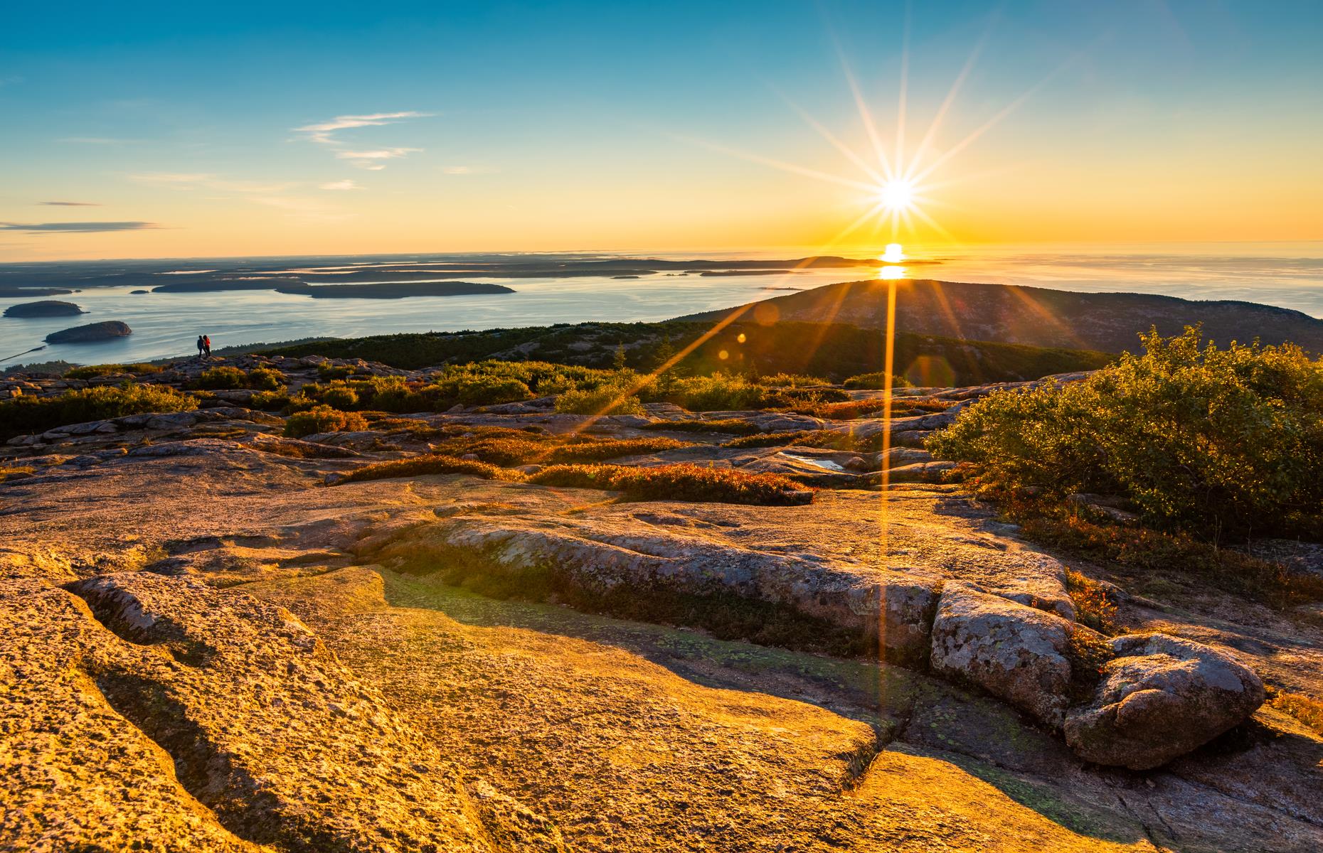 <p>Between October and March, Cadillac Mountain in <a href="https://www.nps.gov/acad/planyourvisit/placestogo.htm">Acadia National Park</a> is the first place in the US where the sky awakens and swirls with blazing red, orange and lilac. Of course, that means getting up earlier to see the sunrise, but there’s also something magical about witnessing the first light to hit the country. There’s a parking lot and a short walk to the summit. As always, make sure to <a href="https://www.nps.gov/acad/planyourvisit/conditions.htm">check </a>if there are any closures inside the park due to changing weather conditions. </p>