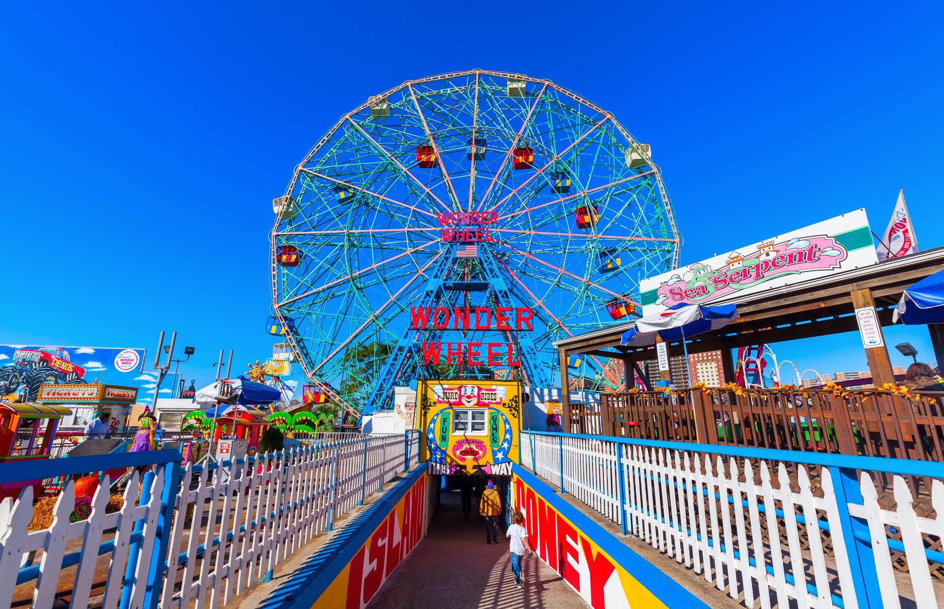 <p>Dig out your retro swimwear and roll up your towel. This crowded yet charming <a href="https://www.nycgo.com/attractions/coney-island">Brooklyn neighborhood</a> is really more like a beach resort and one that’s changed little since the 1950s. Candy floss on the boardwalk, arcades filled with vintage games, amusement park rides and people splashing in the waves – it’s a refreshing escape from hot New York summers.</p>  <p><strong><a href="https://www.loveexploring.com/galleries/84771/what-vacations-looked-like-in-every-decade-since-1900?page=1">Here's what vacations looked like in every decade since 1900</a></strong></p>
