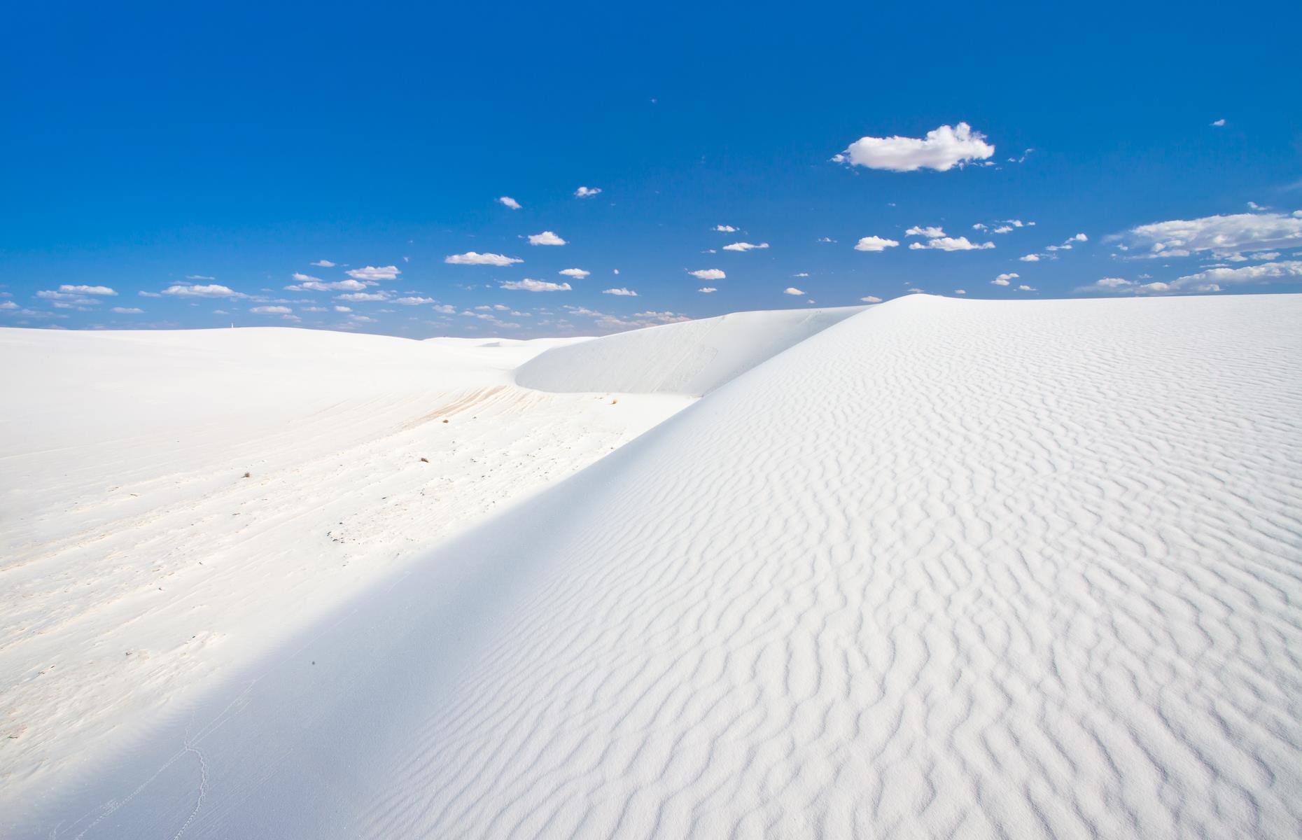 <p><a href="https://www.nps.gov/whsa/index.htm">White Sands</a> isn’t a misnomer: these pale dunes resemble whisked egg whites or soft peaks of Chantilly cream. They roll and ripple for 275 square miles (710sq km) between the Andres and Sacramento mountain ranges. You’ll probably want to jump around and roll down the slopes, and you can: sledding and hiking is permitted.</p>
