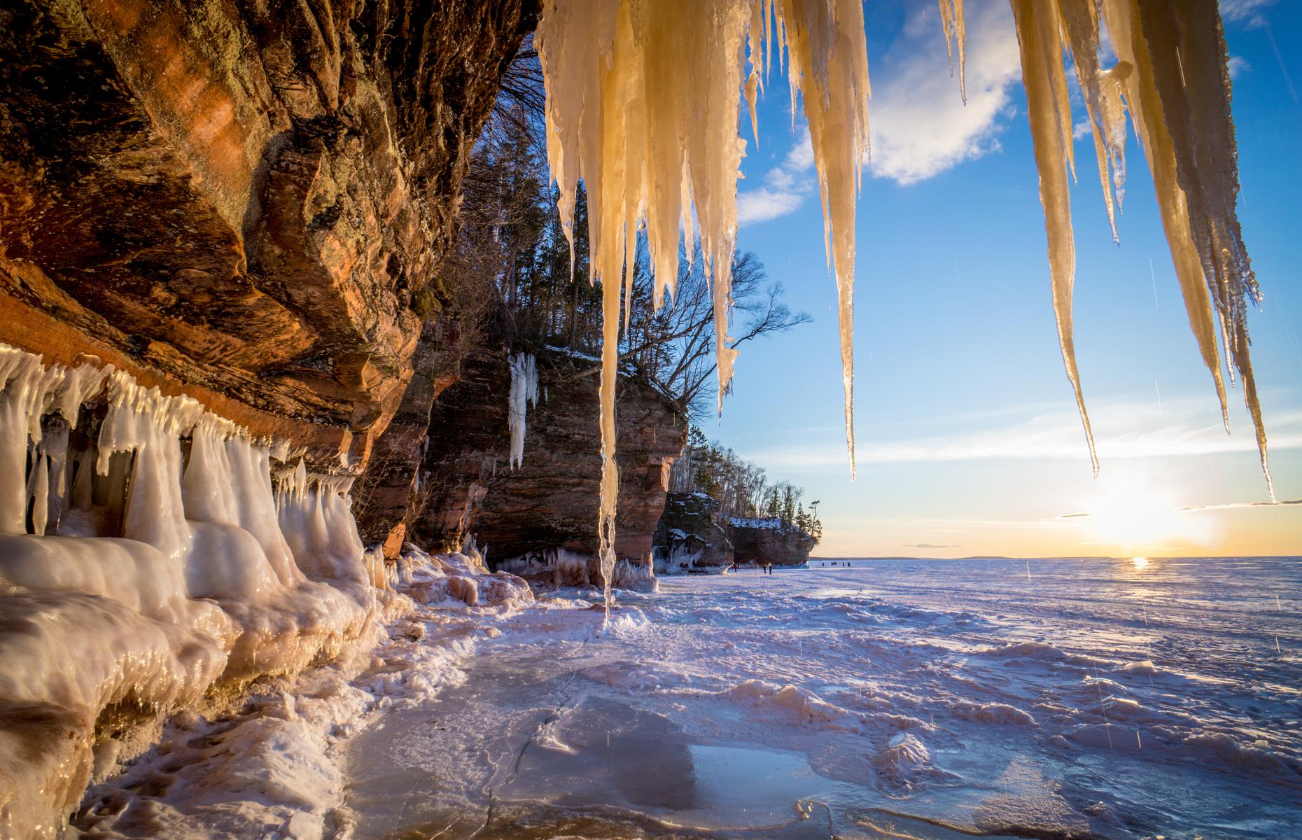 <p>Certain conditions are needed to visit the ice formations at <a href="https://www.nps.gov/apis/index.htm">Apostle Islands National Shoreline</a>. They can only be reached by foot, when the ice on Lake Superior is thick enough to walk on. Some years, it isn’t. But that just makes gazing at this natural spectacle, where caves drip with icicles by the lakeshore, even more spectacular.</p>