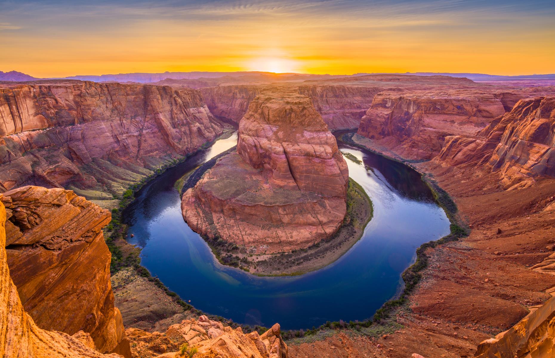 <p>Just outside Grand Canyon National Park, this horseshoe-shaped meander of the Colorado River is easily accessed via the town of Page. Head to the <a href="https://www.visitarizona.com/uniquely-az/parks-and-monuments/horseshoe-bend">Horseshoe Bend Overloo</a><a href="https://www.visitarizona.com/uniquely-az/parks-and-monuments/horseshoe-bend">k</a> before sunset to watch the ancient rocks glow peach, pink and soft lilac, mirrored in the water.</p>  <p><a href="http://bit.ly/3roL4wv"><strong>Love this? Follow our Facebook page for more travel inspiration</strong></a></p>