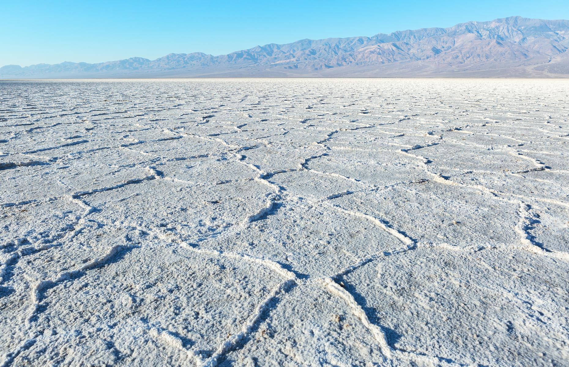 <p>Death Valley’s otherworldly scenery has starred in <em>Star Wars</em> movies and standing on the cracked, crackling salt flats of <a href="https://www.nps.gov/deva/learn/nature/salt-flats.htm">Badwater Basin</a> certainly feels like being in a sci-fi movie. The flats stretch over nearly 200 square miles (520sq km) at the lowest point in North America.</p>