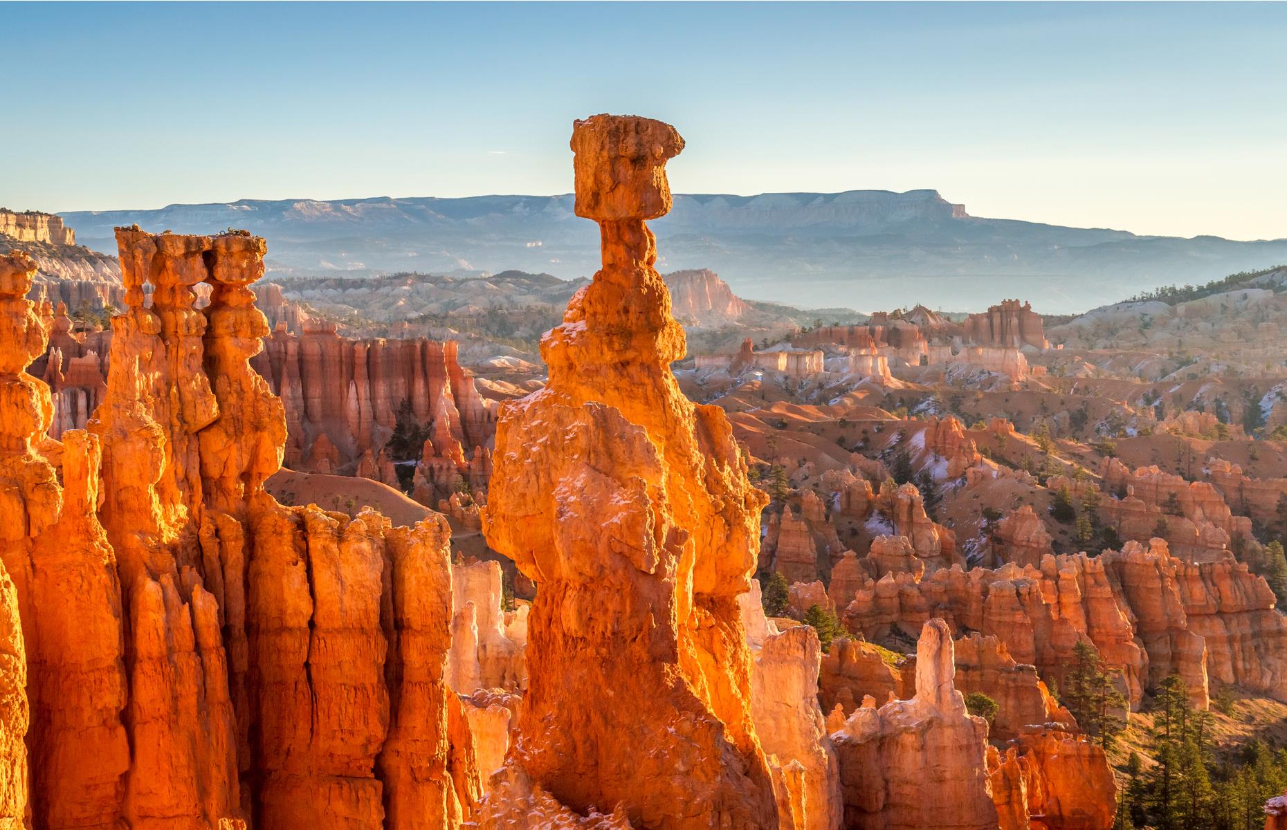 <p><a href="https://www.nps.gov/brca/index.htm">Bryce Canyon's</a> tall, spindly rock spires or hoodoos are the most distinctive feature of this otherworldly landscape, creating a jagged sprawl of apricot and cream towers. Follow hiking trails that wind beneath the strange rock formations, through forest and around the series of natural amphitheaters that make up the national park.</p>