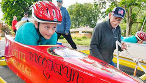 Erie All-American Soap Box Derby youth competitors roll down State Street
