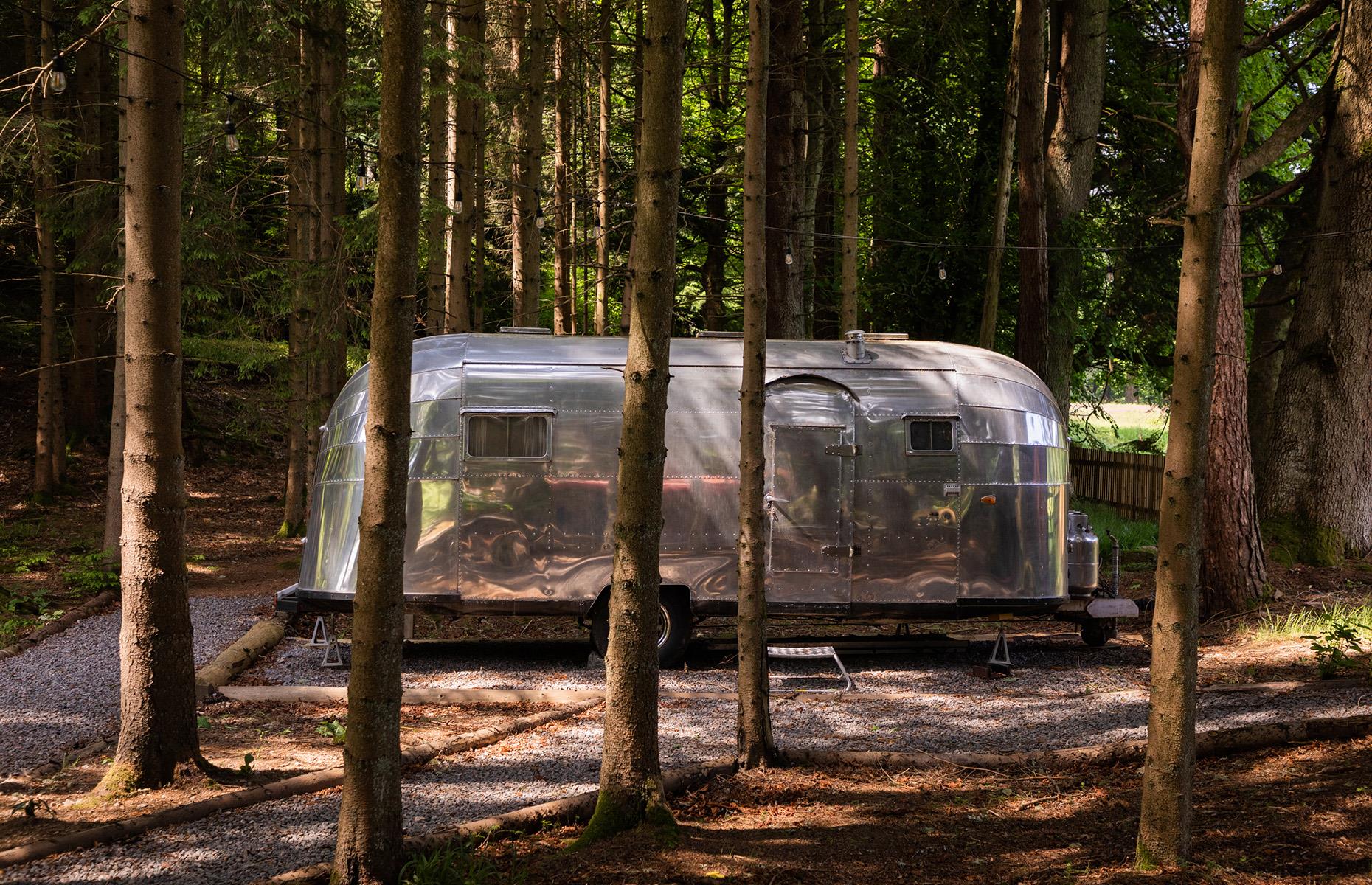 <p>If you go down to the woods of the wonderfully remote and rural <a href="https://www.canopyandstars.co.uk/britain/scotland/aberdeenshire/glen-dye-estate/the-saw-mill">Glen Dye Estate</a>, you might be surprised to find this shimmering Airstream in a private clearing in the forest. With a rustic wood-paneled interior, it has a super king-size bed and a record player and the nearby hut offers a space to lounge around and cook meals when the weather's not on your side. There's even an outdoor, wood-fired bathtub for toasty evening soaks.</p>