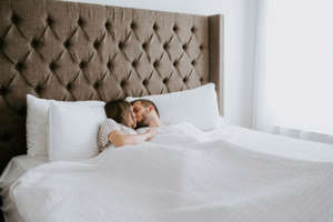 Happy Couple in Cuddling in Bed 