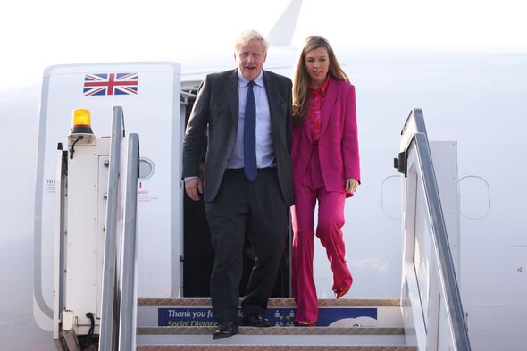 carrie johnson looks chic in hot-pink suit by zara as she arrives in rwanda with boris