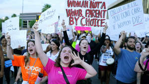 Protesters shout as they join thousands marching around the Arizona Capitol after the Supreme Court decision to overturn the landmark Roe v. Wade abortion decision June 24, 2022, in Phoenix. AP Photo/Ross D. Franklin