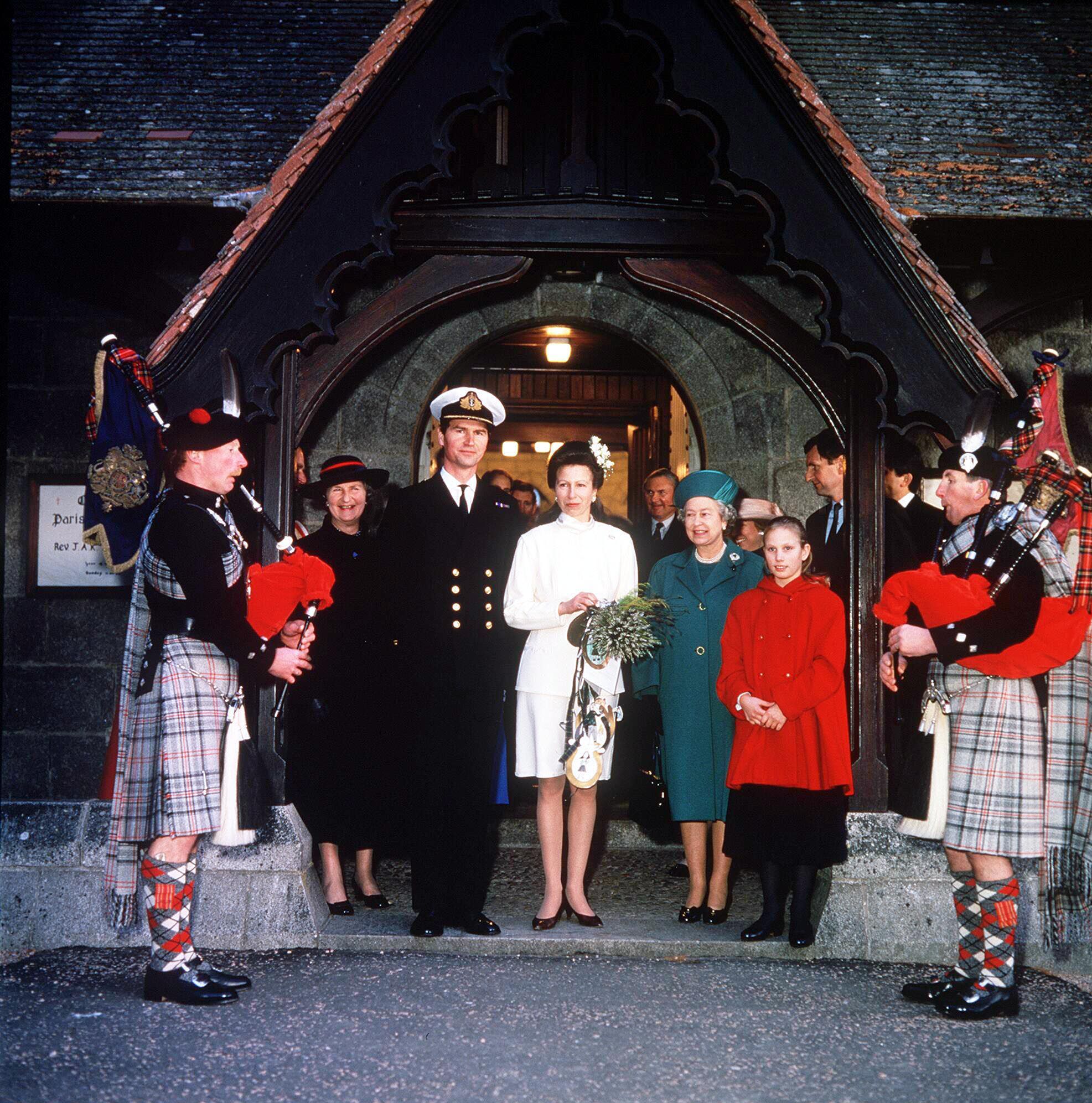 <p>Commander Timothy Laurence and Princess Anne are pictured on their wedding day with Queen Elizabeth II and the bride's daughter, Zara Phillips, at Crathie Church in Balmoral, Scotland, in 1992.</p>