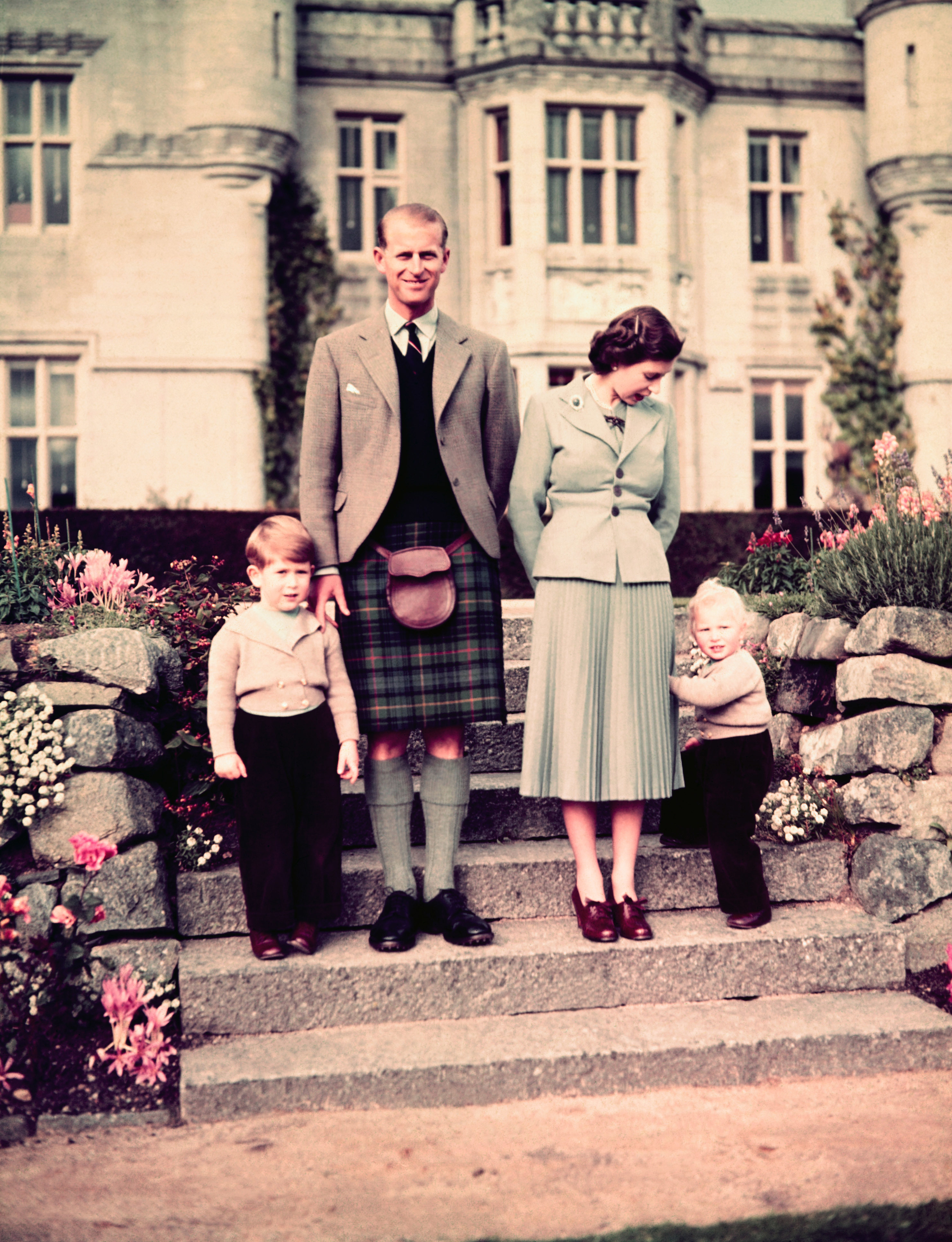 <p>A newly crowned Queen Elizabeth II wore a pleated skirt and three-button jacket while Prince Philip, the Duke of Edinburgh, wore a kilt and Prince Charles and Princess Anne donned corduroys and short woolen jackets outside Balmoral Castle in 1953.</p>