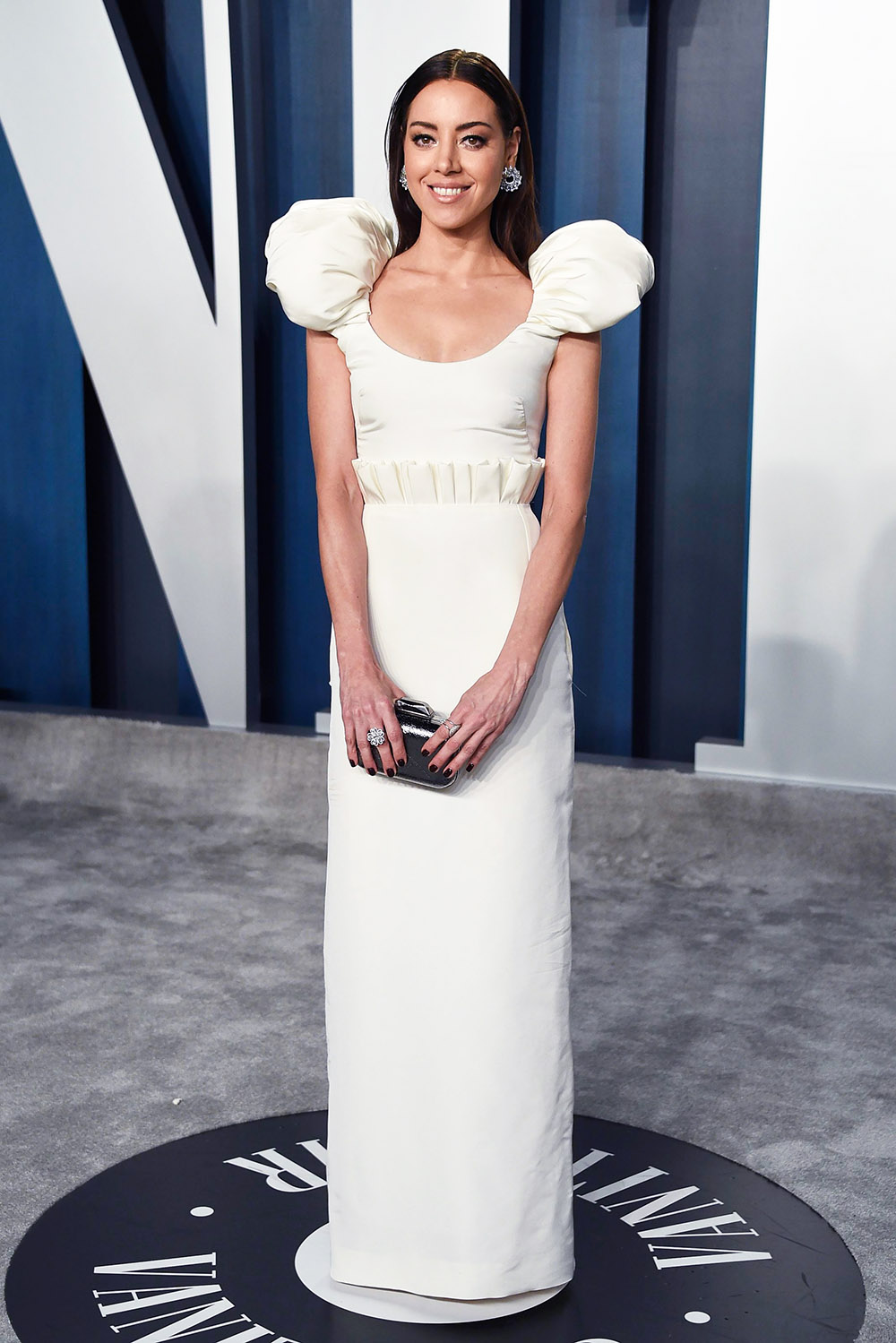 <p>Aubrey Plaza is darling in a puff-sleeved Hellesy design during the Vanity Fair Oscar Party on Feb. 9 2020. Adding another dainty detail, the dress had pleats pointing up at the waist</p>
