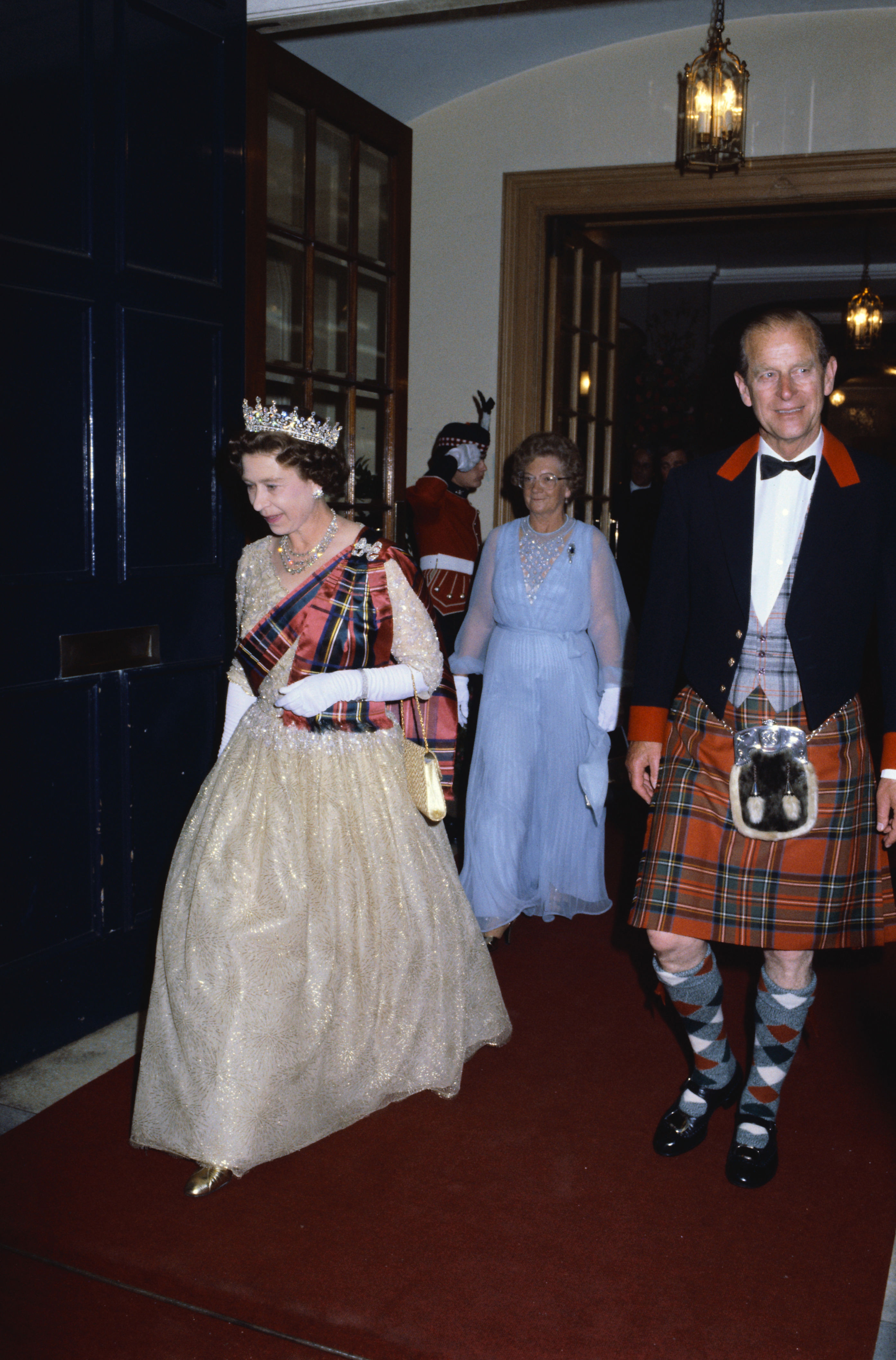 <p>More plaid! Clad in traditional tartan -- a sash for her, a kilt for him -- Queen Elizabeth II and Prince Philip arrived at the Royal Scottish Piper's Society Ball in the Assembly Rooms in Edinburgh, Scotland, on July 2, 1982.</p>