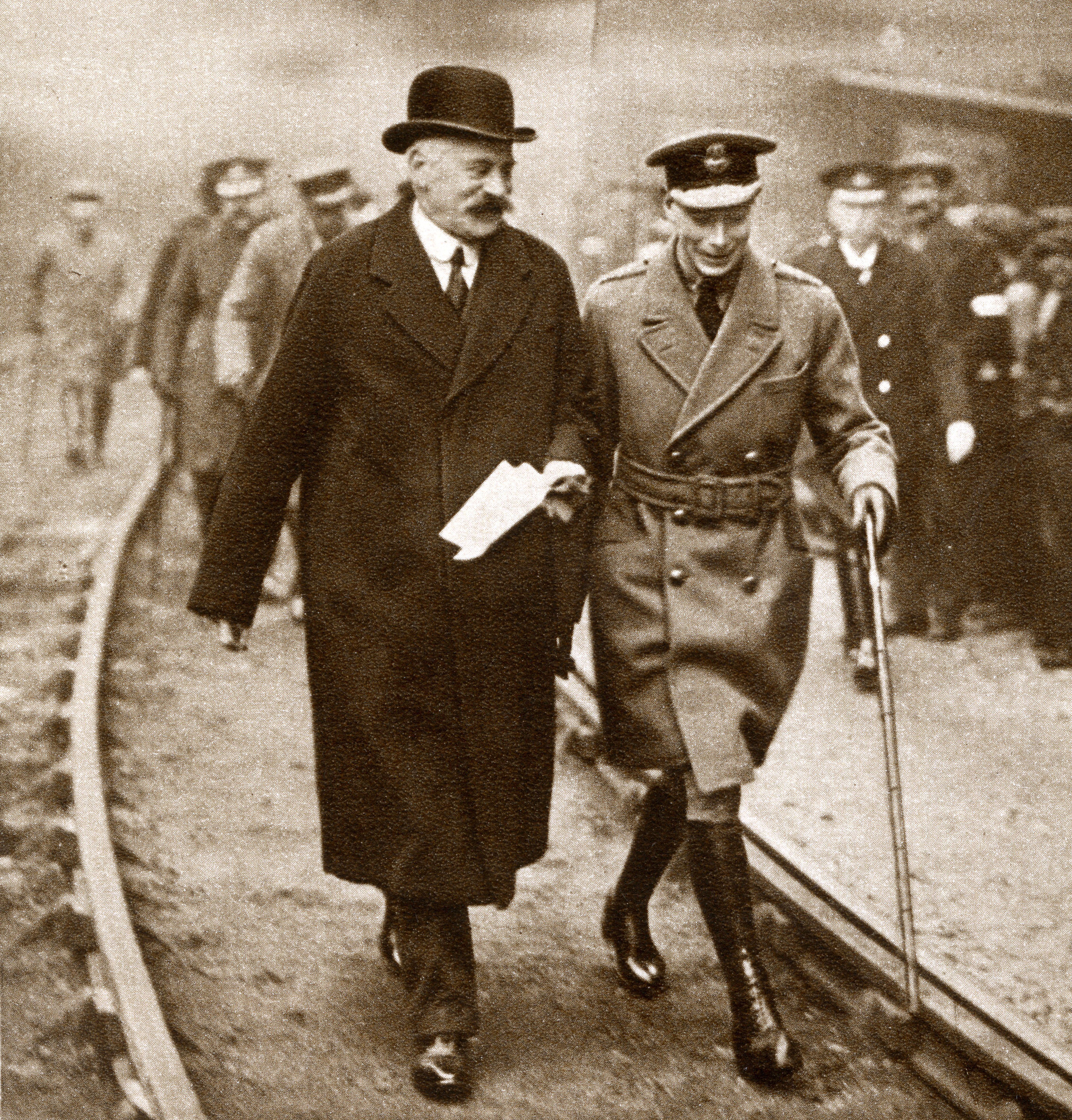 <p>Prince Albert (later King George VI) spent eight hours inspecting Glasgow, Scotland, factories in December 1919, including during a visit to William Beardmore and Company, a Scottish engineering and shipbuilding conglomerate. He's pictured walking with William Beardmore, 1st Baron Invernairn, in 1919.</p>
