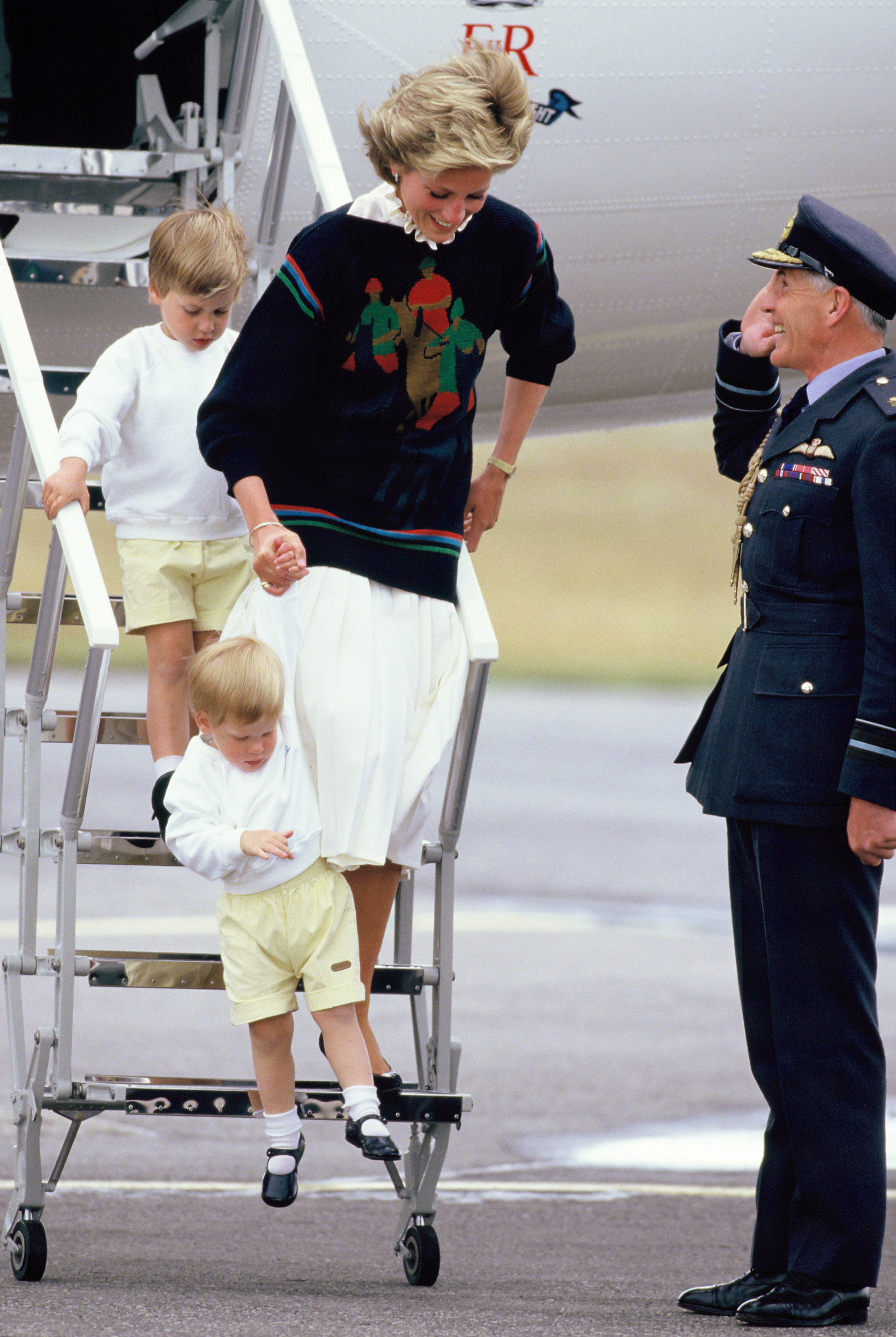 <p>Princess Diana and young sons <a href="https://www.wonderwall.com/celebrity/profiles/overview/prince-william-482.article">Prince William</a> and <a href="https://www.wonderwall.com/celebrity/profiles/overview/prince-harry-481.article">Prince Harry</a> arrived at Aberdeen Airport in Scotland on Aug. 15, 1986, to start their summer holidays with the queen.</p>