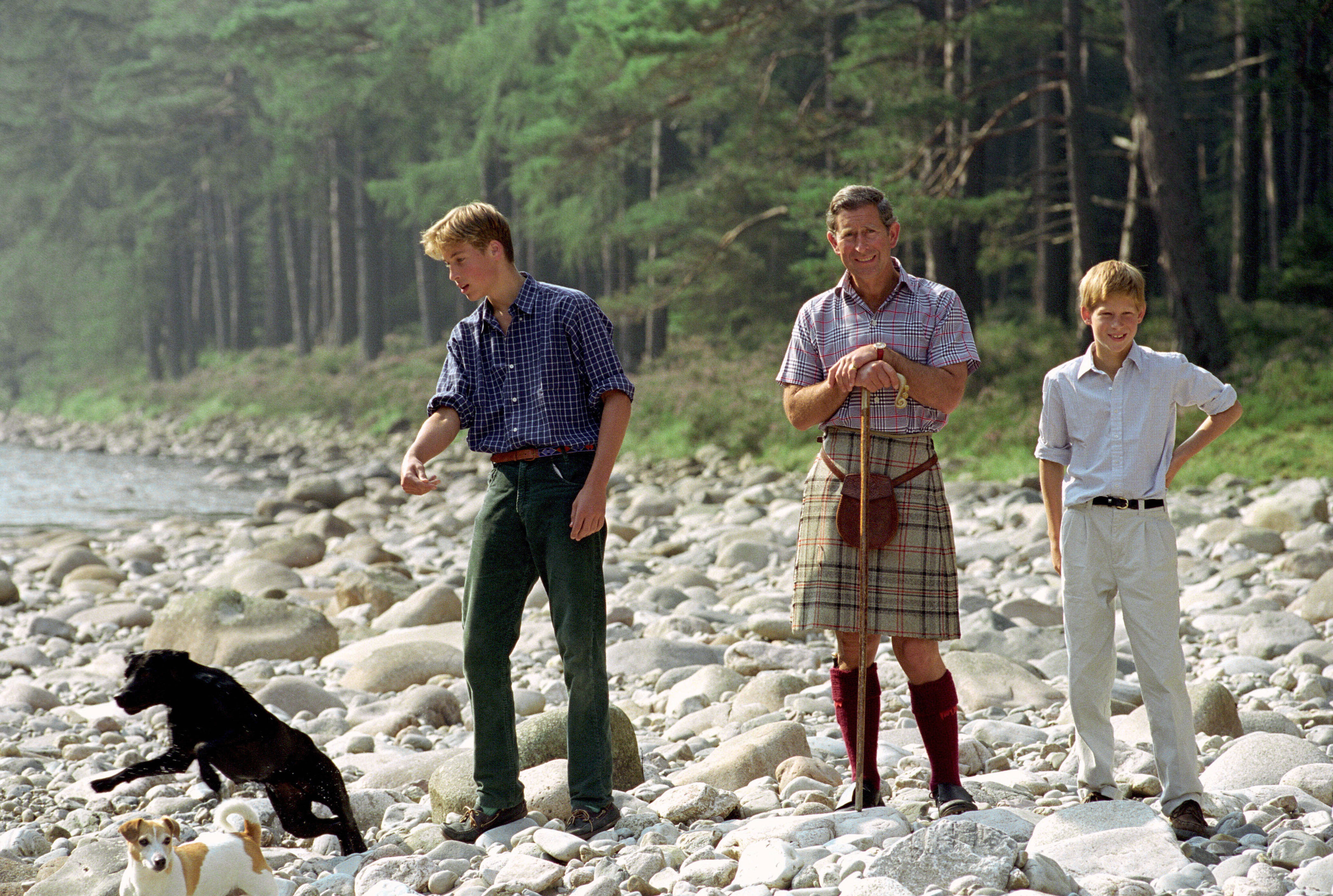 <p>A kilt- and sporran-clad Prince Charles, who carried a shepherd's crook walking stick, visited Polvier by the River Dee on the queen's Balmoral estate in Scotland with <a href="https://www.wonderwall.com/celebrity/profiles/overview/prince-william-482.article">Prince William</a> and <a href="https://www.wonderwall.com/celebrity/profiles/overview/prince-harry-481.article">Prince Harry</a> and their dogs, black Labrador retriever Widgeon and Jack Russell terrier Tigga, on Aug. 10, 1997.</p>