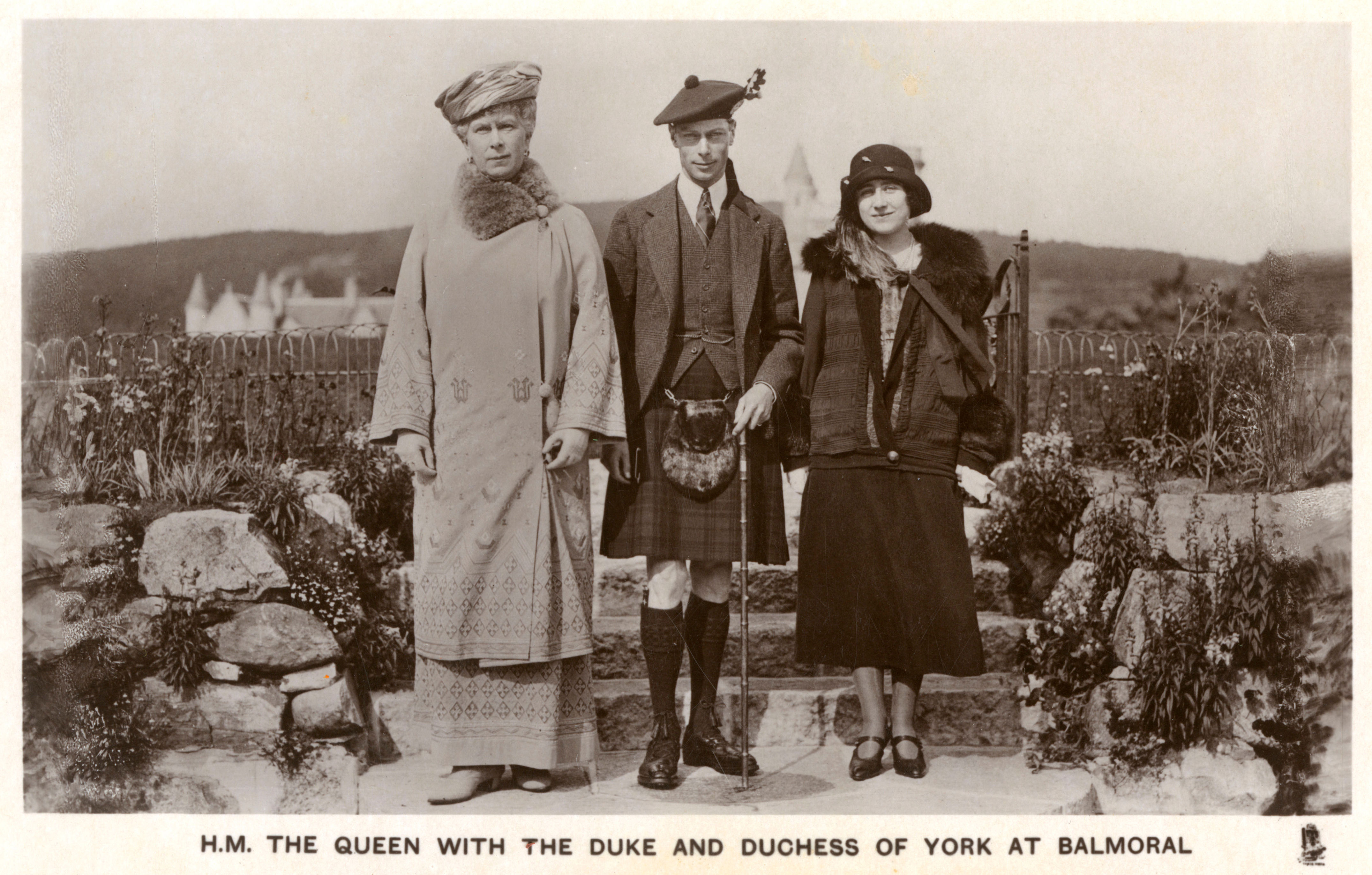 <p>Queen consort Mary of Teck posed with son Albert, Duke of York (later King George VI) and his wife, Elizabeth, Duchess of York (later Queen Elizabeth the Queen Mother) on the grounds of Balmoral in Scotland during their annual autumn visit at some time during the 1930s.</p>