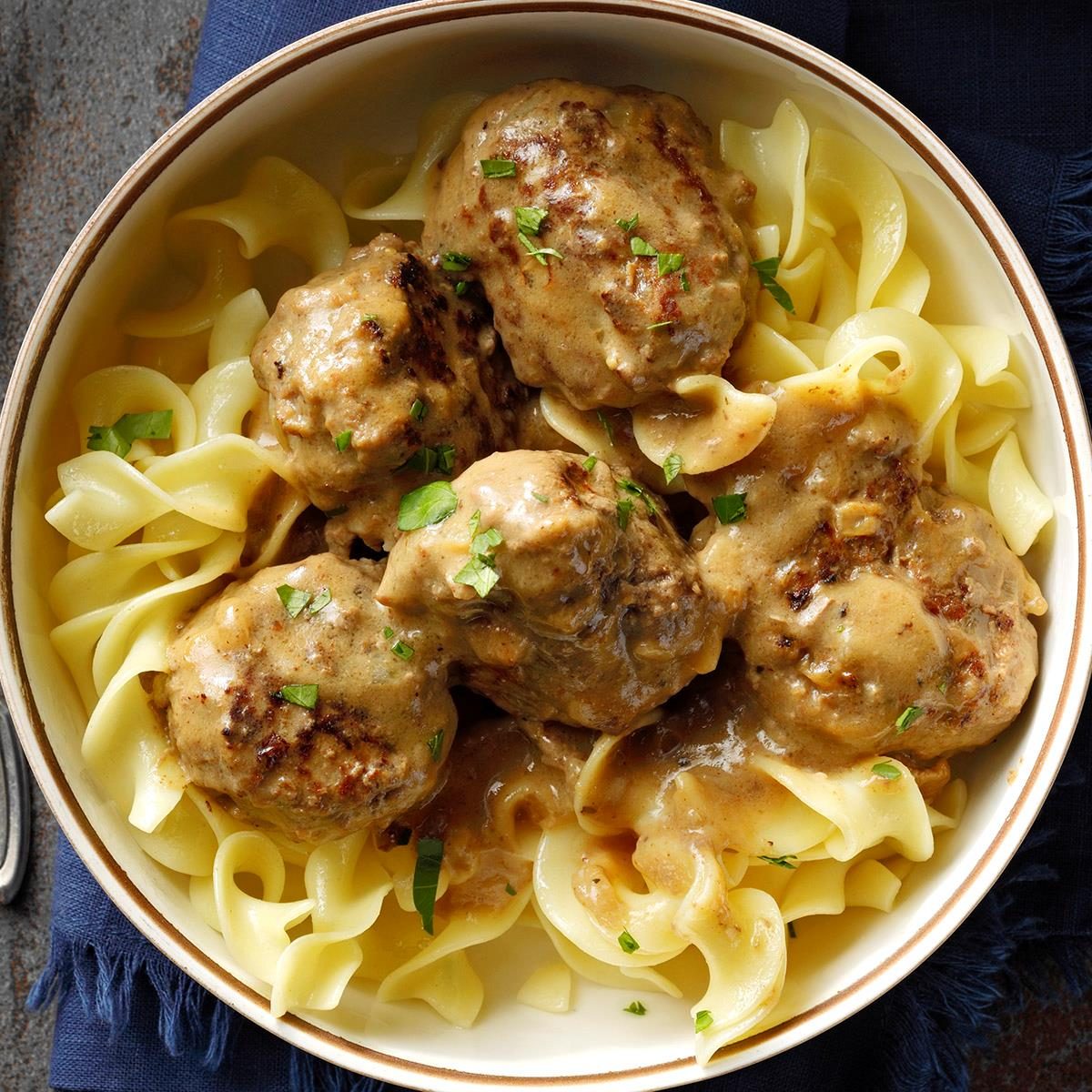 <p>I can still see Grandmother making dozens of these little meatballs, and gravy to go with them! The hint of spices gives them a savory taste that makes them authentically Norwegian. —Karen Hoylo, Duluth, Minnesota</p> <div class="listicle-page__buttons"> <div class="listicle-page__cta-button"><a href='https://www.tasteofhome.com/recipes/meatballs-and-gravy/'>Go to Recipe</a></div> </div>