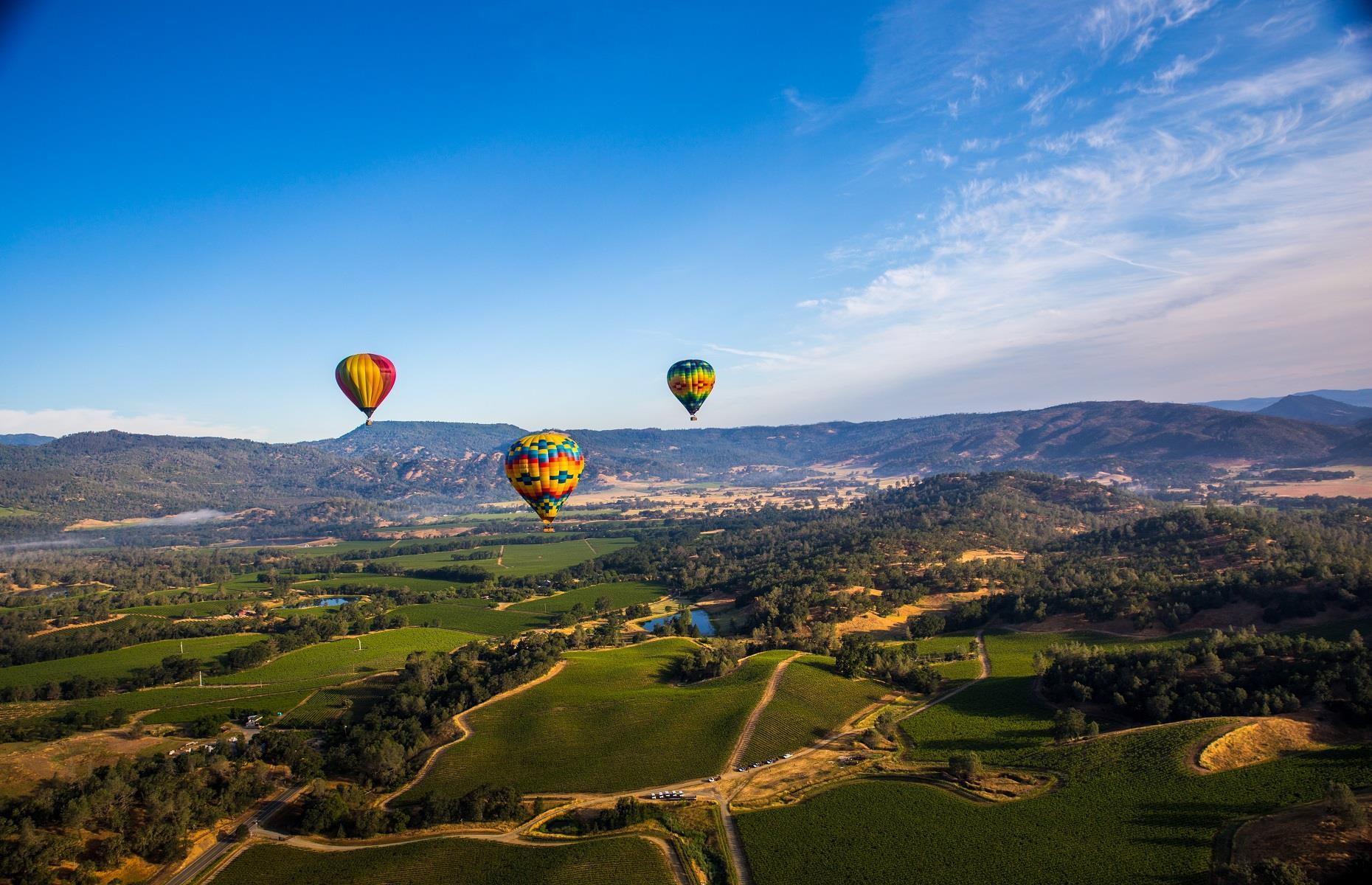 <p>Known for its hundreds of hillside vineyards and world-class vintages, <a href="https://www.loveexploring.com/guides/82205/an-areabyarea-guide-to-californias-wine-regions">California</a>'s Napa Valley is as glorious to look at as its wines are to sip. Experience America's iconic wine country like never before by taking a <a href="https://napavalleyballoons.com/">Napa Valley hot air balloon tour</a>. Rise early for a sunrise hot air balloon trip to savor the splendor of the landscape, before touching down to sample some of the region's best bottles.</p>