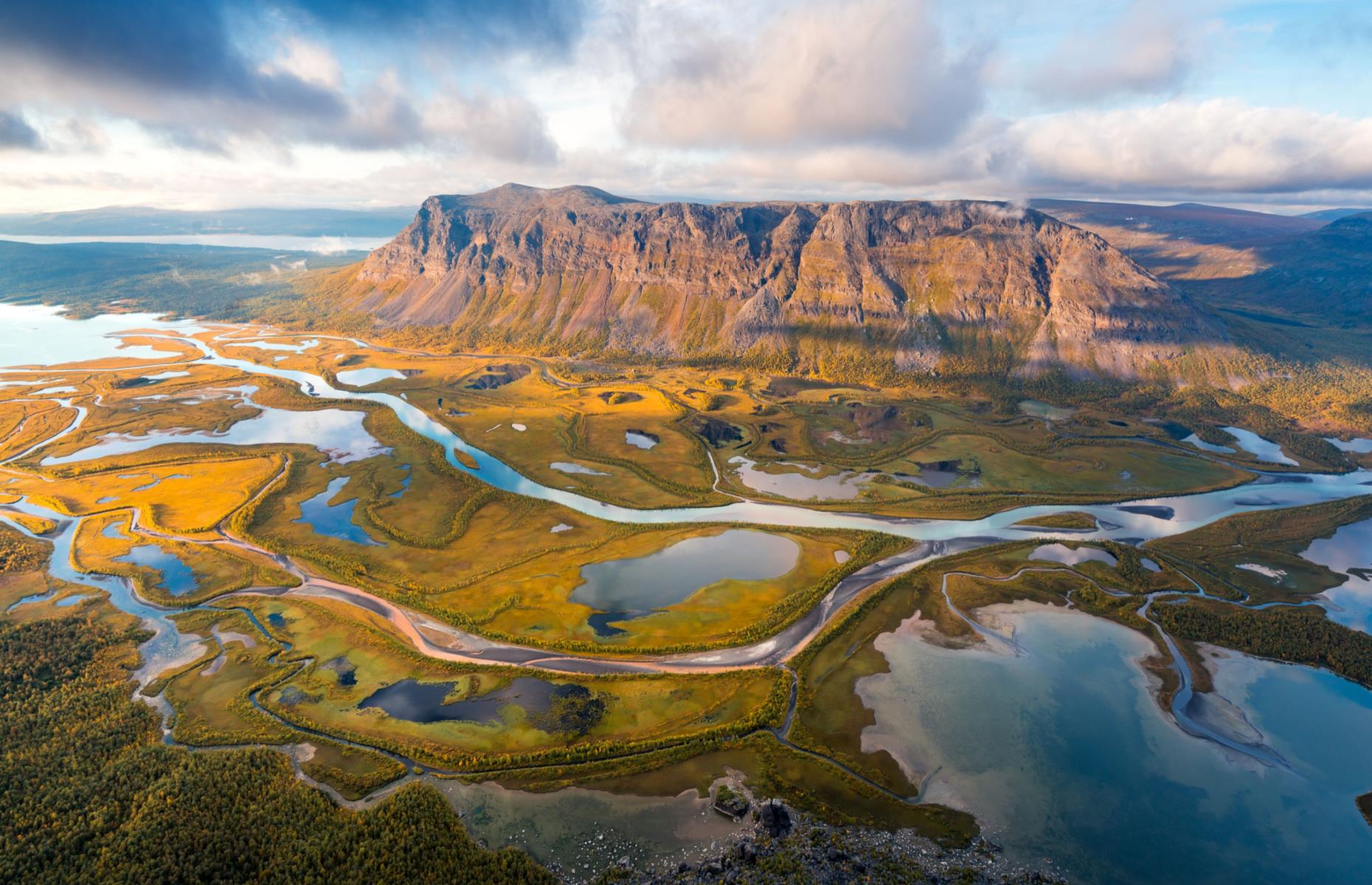 <p>Located in the otherworldly Lapland, <a href="https://www.nationalparksofsweden.se/choose-park---list/sarek-national-park/">Sarek</a> is jam-packed with mountain peaks and peculiar-looking deltas that give the land a spectacularly eerie look. Getting to Sarek can be a bit of an ordeal and a trip to the park is not for the faint of heart, with visitors having to either hike or ski in. Once there, adventurers can hike on unmarked trails and truly feel like they’re at one with the wilderness.</p>