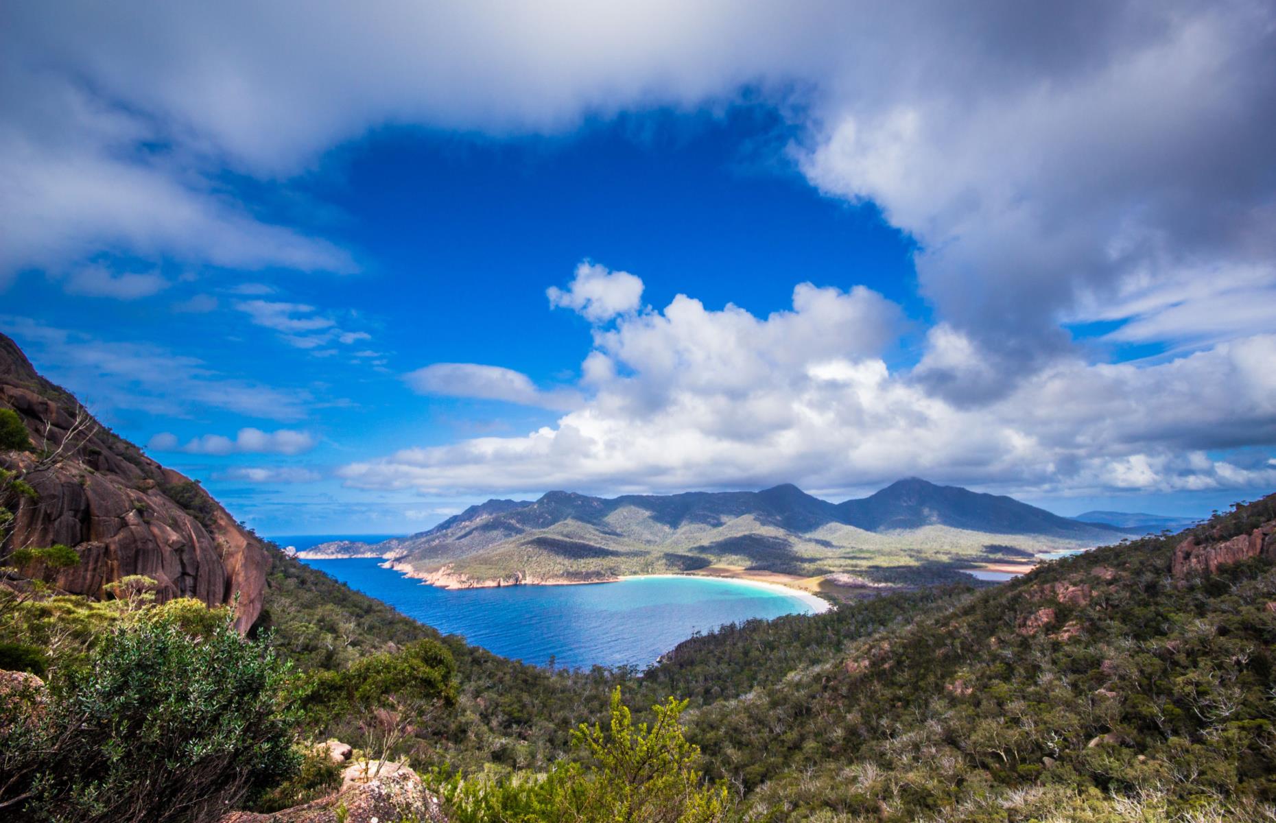 <p>Tasmania’s <a href="https://parks.tas.gov.au/explore-our-parks/freycinet-national-park">Freycinet National Park</a> doesn’t have a landmark like the famous Uluru rock monolith, but it makes up for it with some sublime coastal views. The must-see attraction here is the curved white sand coastline of Wineglass Bay and the long narrow peninsula has plenty of other gems along its shores. It’s not all beaches and turquoise waters: Freycinet also has some interesting terrain in the form of the Hazards, a range of pink granite mountains.</p>