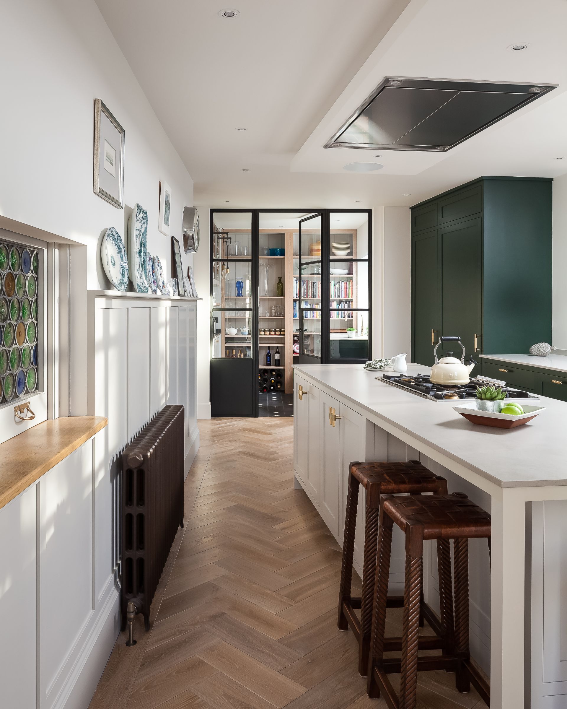 <p>                     The pantry and utility have long hit the top of the wish list for a country kitchen and it’s turned out to be a modern dream too.                    </p>                                      <p>                     It’s a practical set up for a sleek kitchen designed for entertaining as it keeps the service areas out of sight.                   </p>