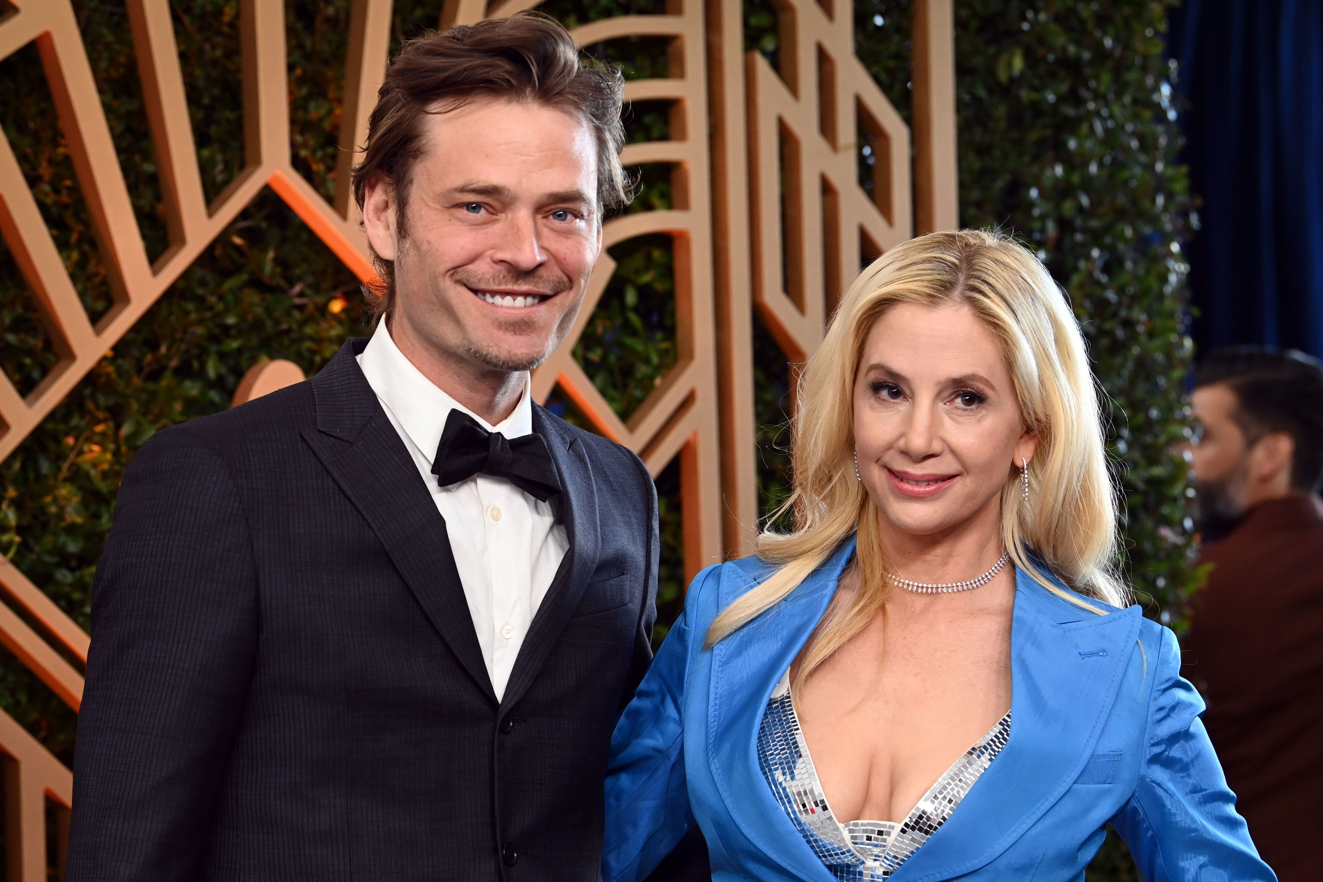 <p>There are 14 years between Oscar winner Mira Sorvino and actor husband Christopher Backus. When the couple (seen here at the <a href="https://www.wonderwall.com/awards-events/red-carpet/2022-sag-awards-celebs-on-the-red-carpet-at-the-screen-actors-guild-awards-this-year-564788.gallery">2022 SAG Awards</a>) -- who are now parents of four -- married in 2004, she was 36 and he was 22. </p>
