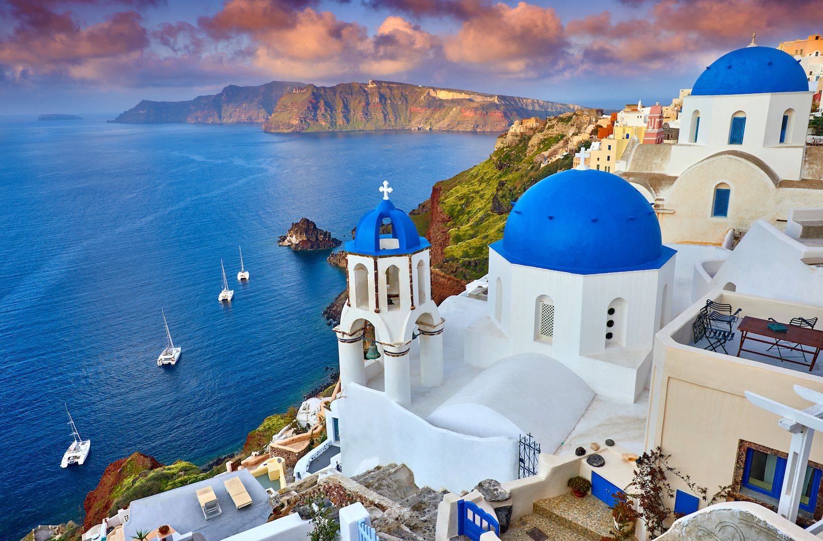 <p>                     The whitewashed, blue-capped houses of the Greek village of Fira are typical of the many picturesque villages of modern-day Greece. But these particular houses, along with those of Fira's sister city Oia, are perched impossibly on the ridge of a caldera and command a bold, panoramic view of the surrounding Aegean Sea.                    </p>                                      <p>                     The caldera is the remnant of the ancient island of Thera, now called Santorini. Situated in the southern Aegean Sea and forming the southernmost of the Cyclades group of islands, Santorini is a volcanic island located 120 miles (200 km) southeast of the Greek mainland. It is famous for its rugged landscape, towering cliffs displaying distinct and colorful geologic layers, volcanic beaches, romantic sunsets and 360-degree view of the deep-blue Aegean Sea.                    </p>                                      <p>                     Santorini is also famous for the catastrophic volcanic eruption that occurred 3,600 years ago, during the height of the Minoan civilization, according to the World History Encyclopedia. The eruption destroyed much of the island, spewing a massive cloud of ash and debris into the air, creating a water-filled caldera and breaking the island into several separate islands. The eruption also destroyed the ancient village of Akrotiri, the most famous Minoan settlement outside Crete. First excavated in 1967, it is now a well-known archaeological site, some of it partially reconstructed but much of it, like Pompeii, still preserved under a thick layer of ash. The site is famous for its well-studied frescoes, or wall paintings, which depict fishermen, boats, dolphins and well-manicured Minoan ladies of high rank.                    </p>                                      <p>                     Santorini is a major tourist destination, and the archaeological site of Akrotiri is a UNESCO World Heritage Site.                    </p>