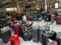 Piles of luggage at British Airways' Heathrow home at Terminal 5. Adam Kent