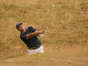 Patrick Reed of the US plays out of the rough on the 17th hole.