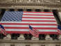 United States flags fly outside of the New York Stock Exchange. REUTERS/Lucas Jackson