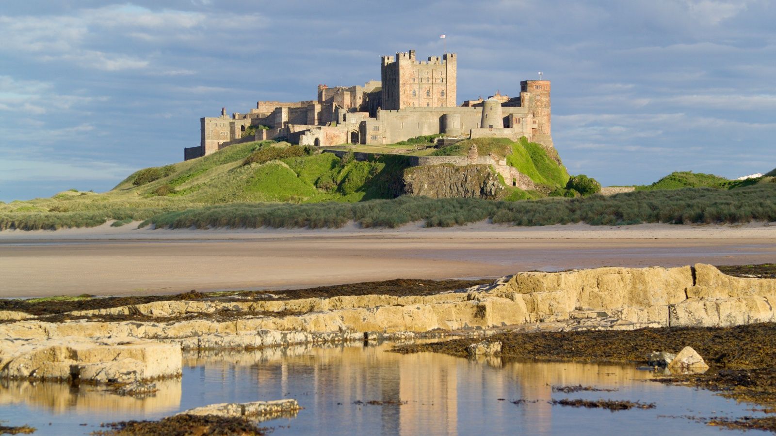 <p>                     <strong>Location: </strong>Northumbria, NE69 7DF | <strong>Website: </strong>bamburghcastle.com                   </p>                                      <p>                     Once the royal seat of the Kingdom of Northumbria, Bamburgh was a fearsome stronghold throughout the Middle Ages. The Norman-built fortress spans nine acres, and rests upon a rocky volcanic crag, with views stretching down the windswept Northumberland coast and across the North Sea to the Farne Islands.                   </p>                                      <p>                     Its fortified walls—11ft thick at points—were a formidable line of defense against marauding armies. Today, you can enjoy a more serene stay in the castle’s elegant, turreted guard towers, 150ft above the white sands of Bamburgh Beach.                   </p>